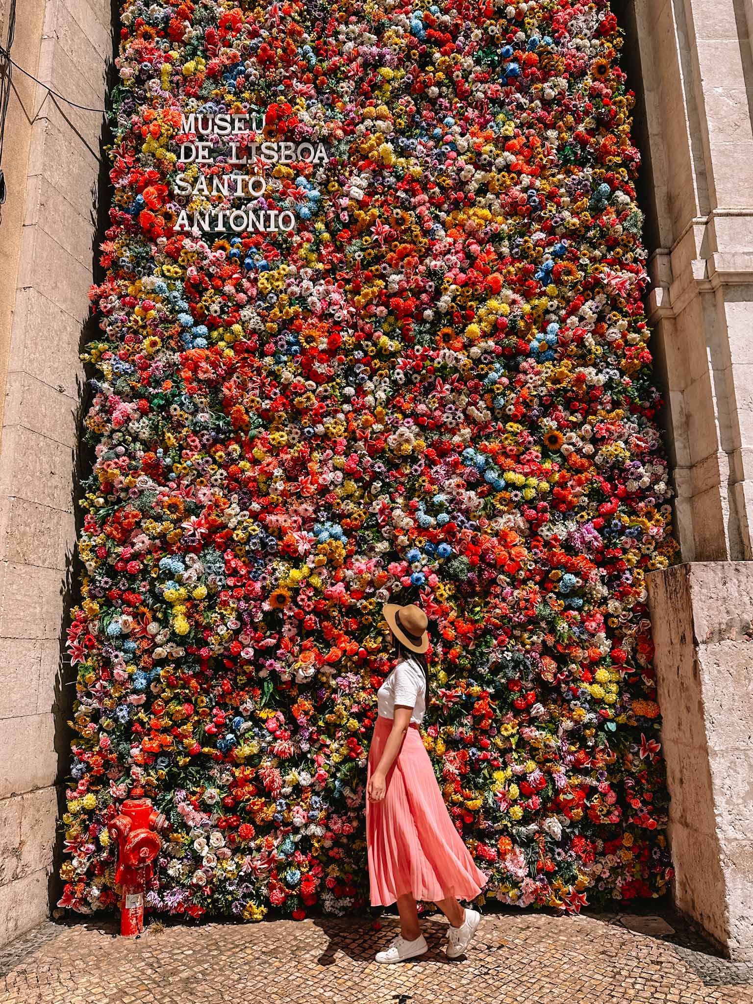 Best Instagram photo spots in Lisbon, Portugal - Flowerwall at the Museum of Saint Anthony