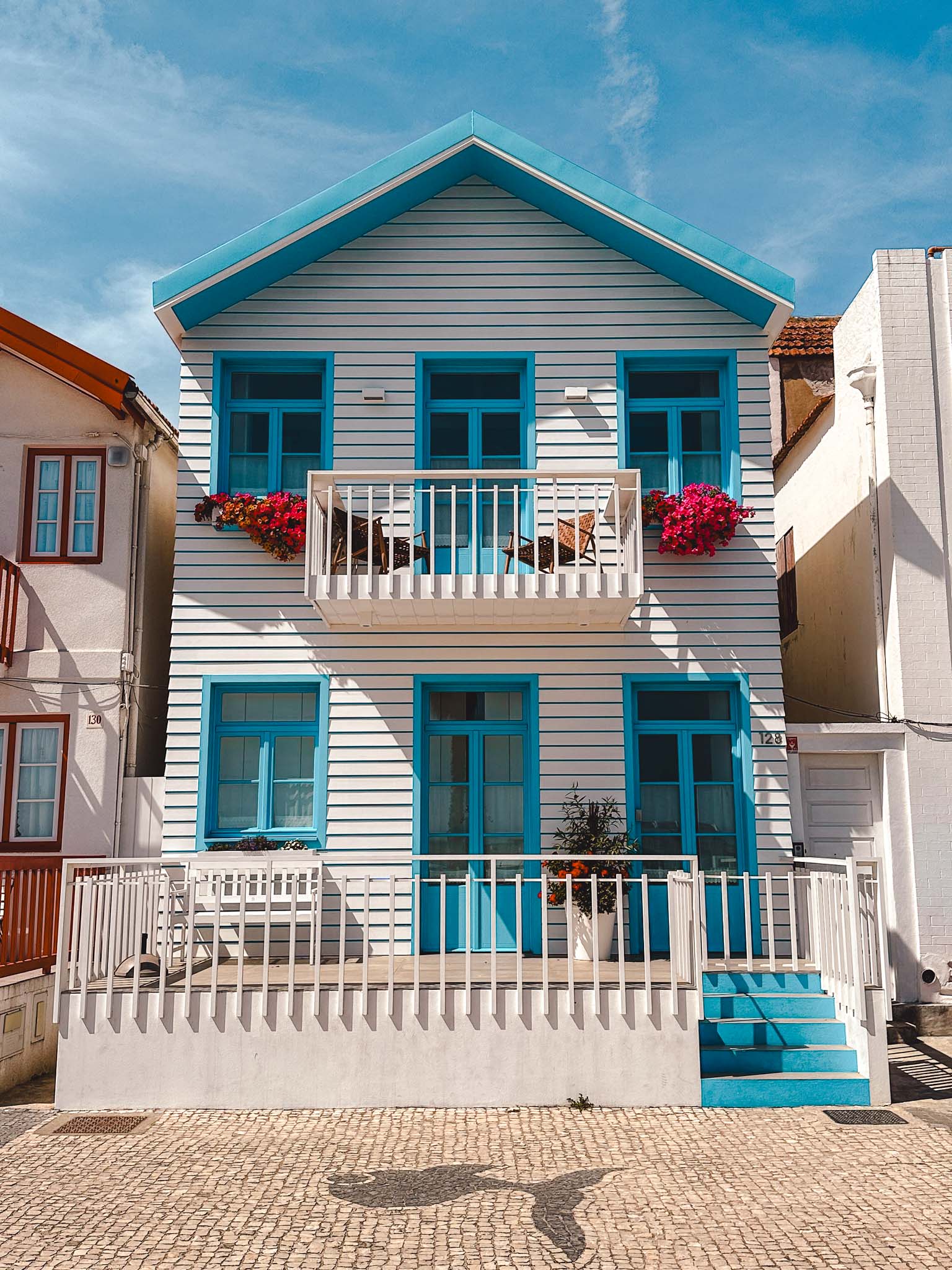 Best things to do in Aveiro, Portugal - candy striped fishermen's houses at Costa Nova