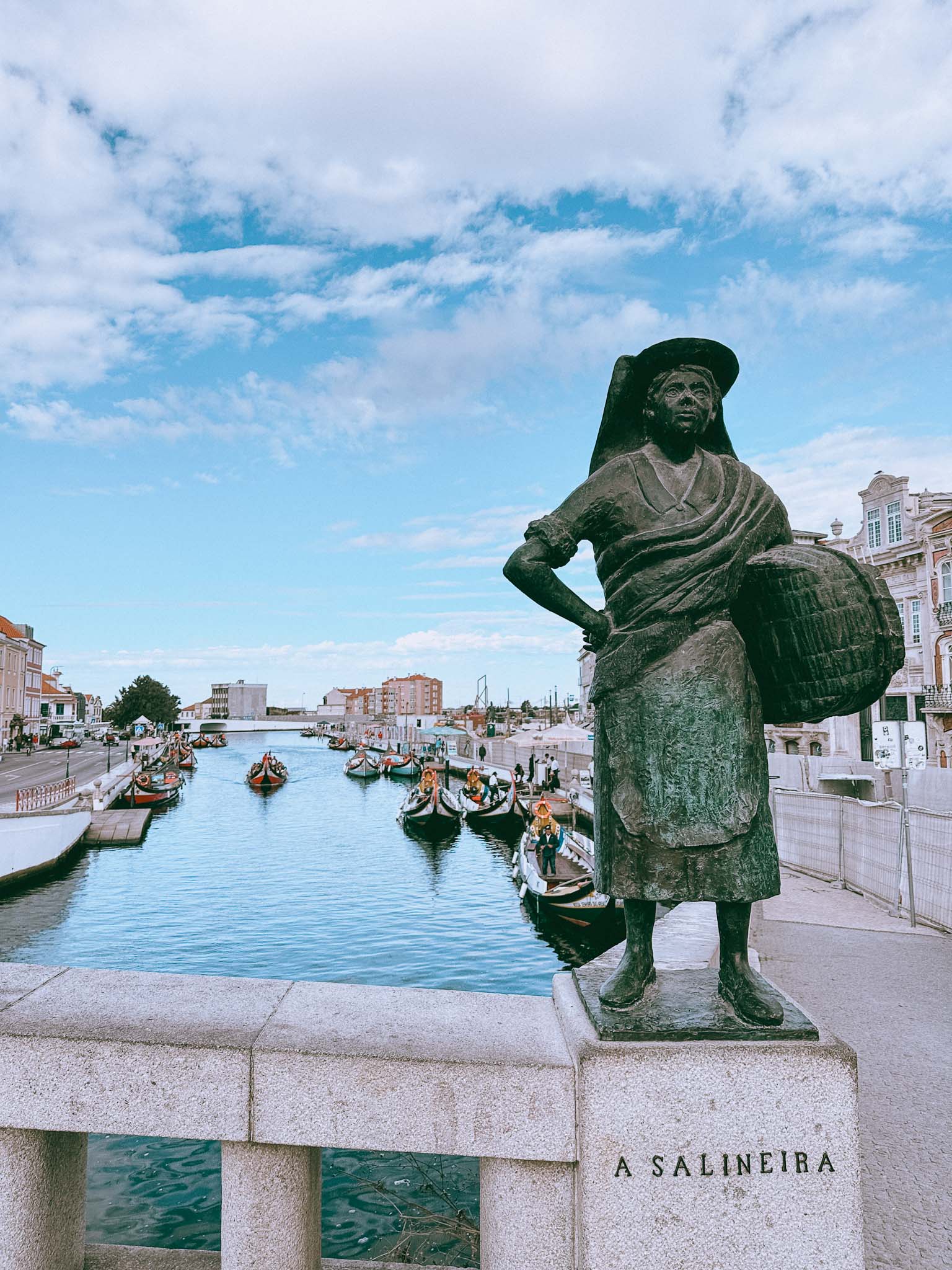Best things to do in Aveiro - visit the four traditional statues on the bridge