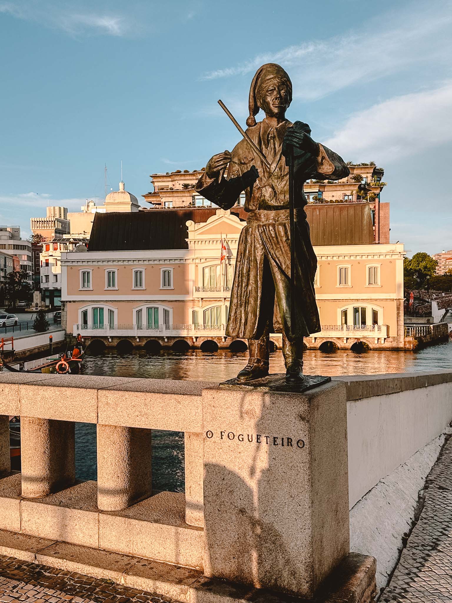 Best things to do in Aveiro - visit the four traditional statues on the bridge