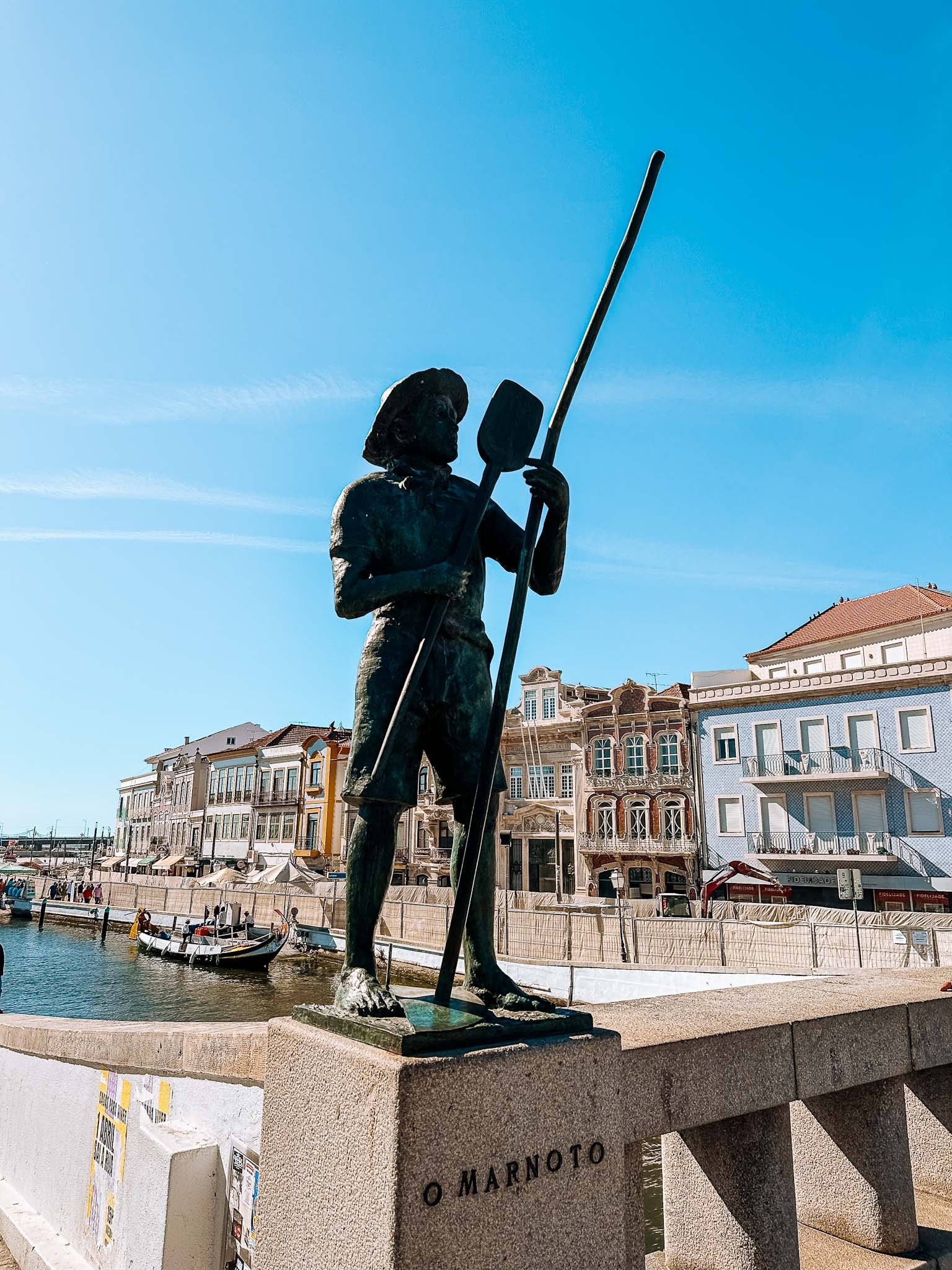 Best things to do in Aveiro - visit the four traditional statues on the bridge