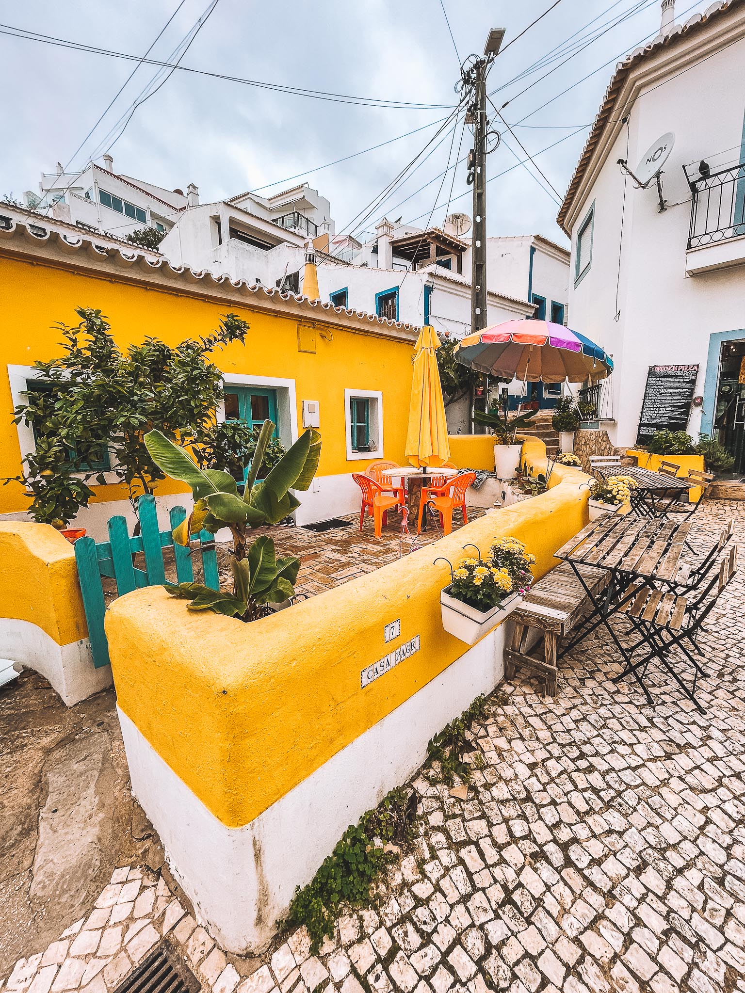 Yellow house in Burgau fishing village in Algarve, Portugal