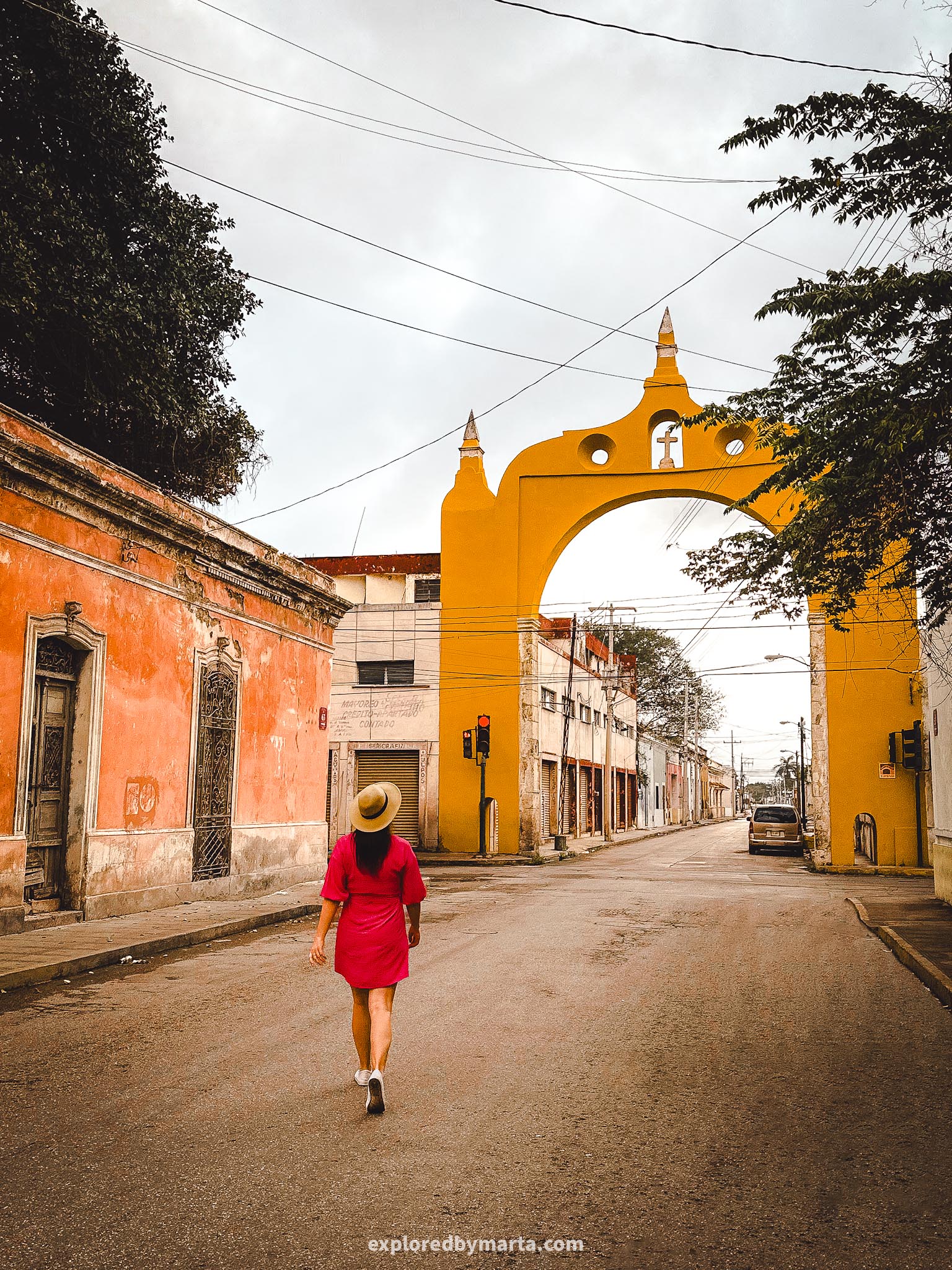 Merida, Mexico-Arco del Puente yellow arch stretching over a street in Merida, Mexico