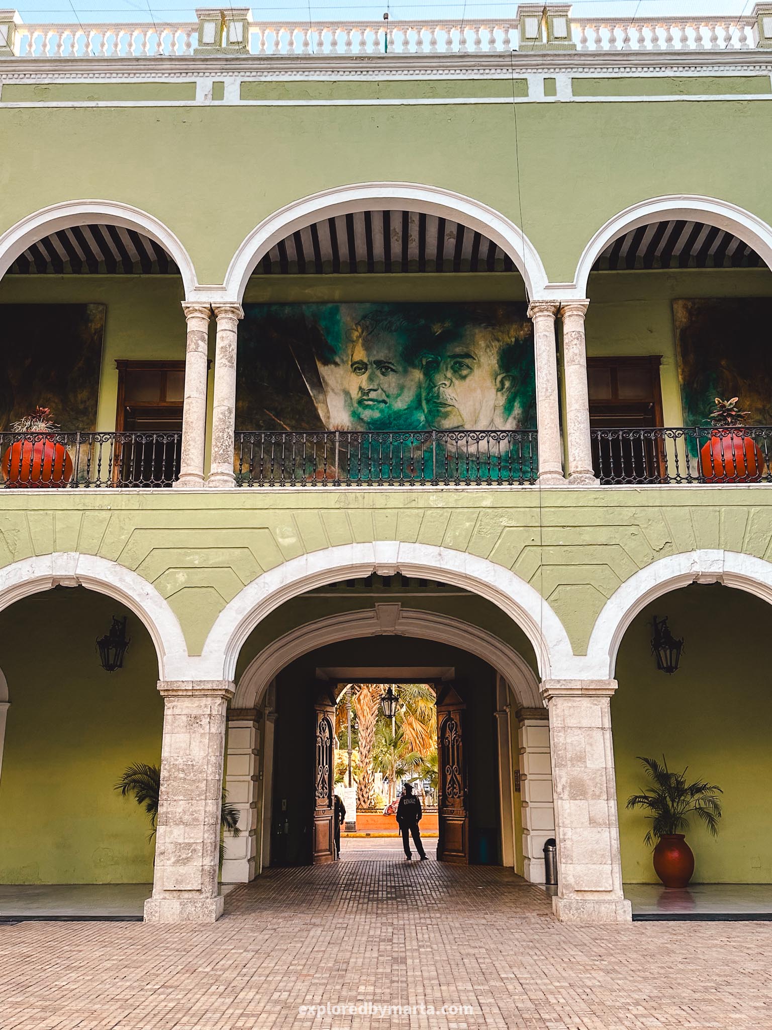 Merida, Mexico - Palacio de Gobierno del Estado de Yucatán - a green 19th century government building with arcaded courtyard and murals on the walls