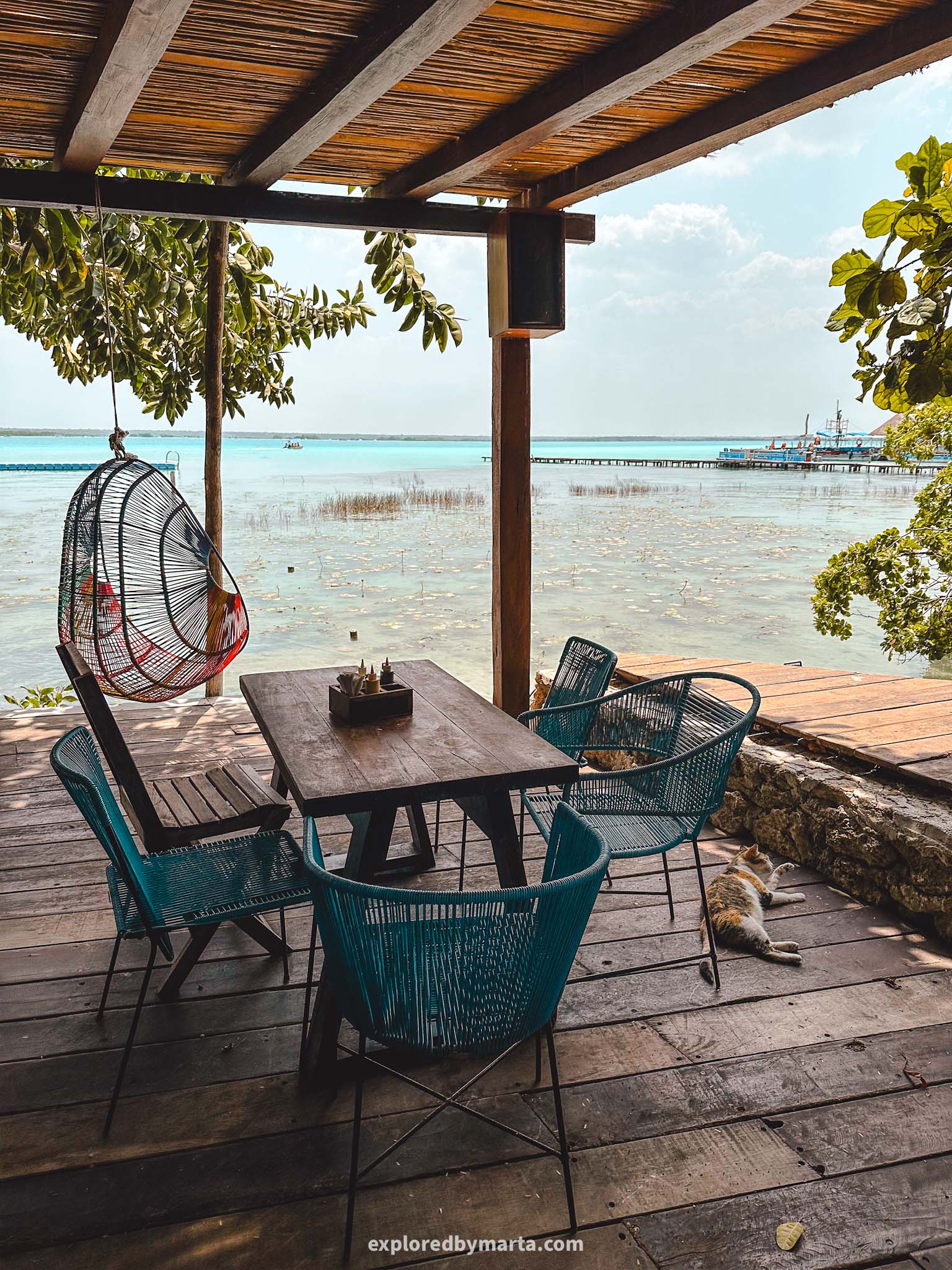Bacalar, Mexico-have lunch at one of Bacalars waterfront restaurants La Playita with a wooden deck stretching into the Lagoon of Seven Colors