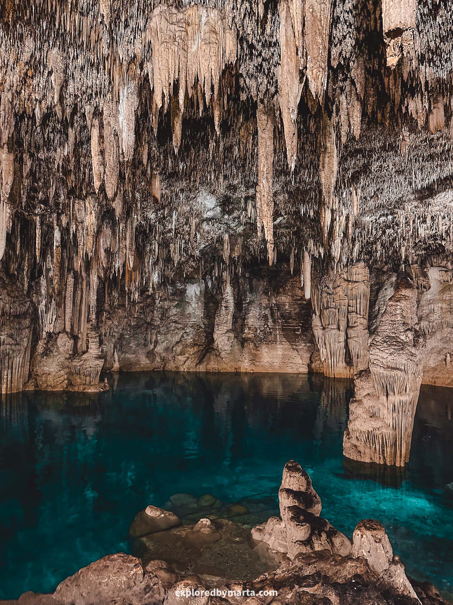 Playa del Carmen, Mexico-Rio Secreto Nature Reserve features crystal clear water and massive rock formations like stalactites and stalagmites