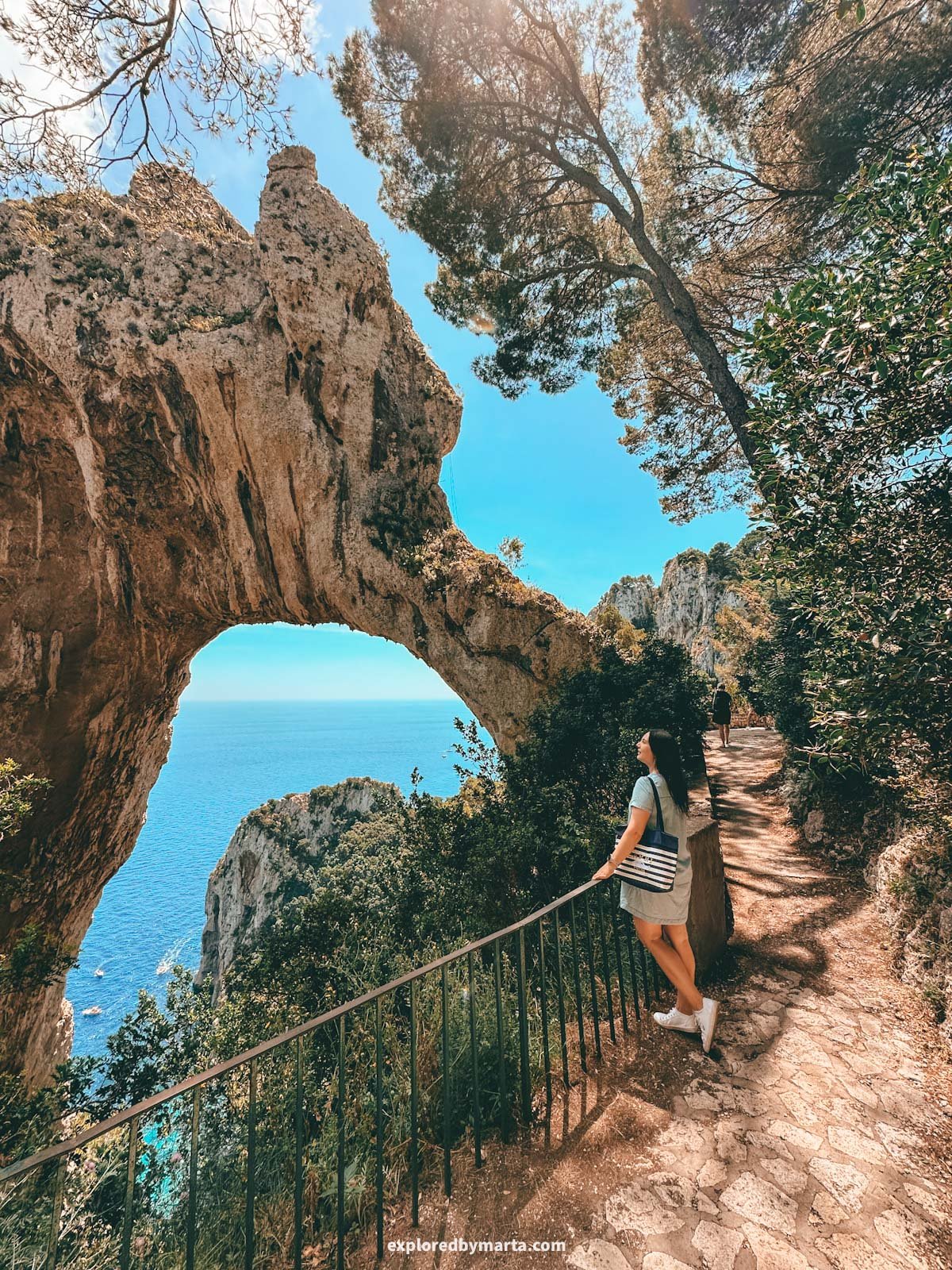 Natural rock arch during Pizzolungo trail in Capri Island, Italy
