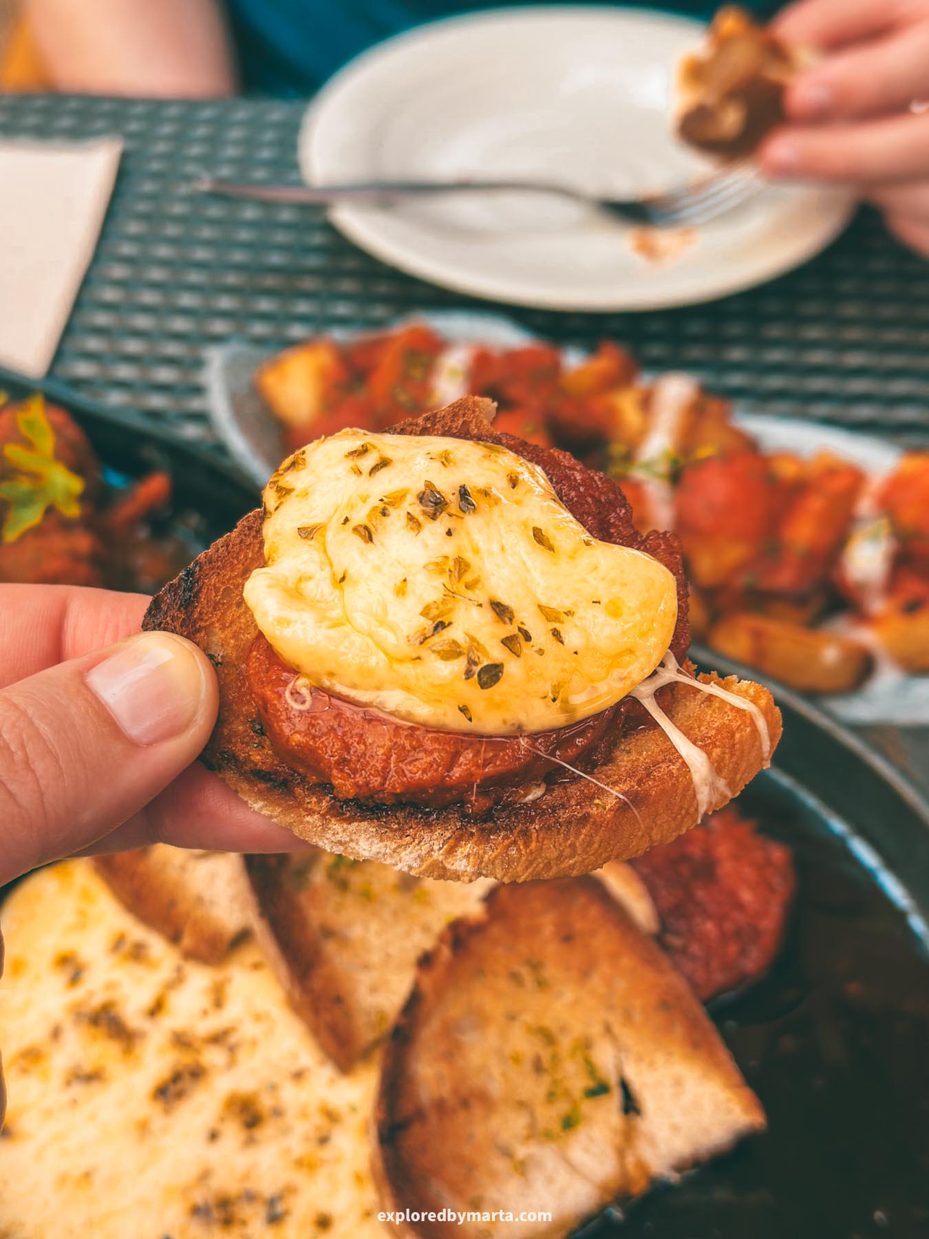 Mallorca, Spain-tapas with melted cheese and sobrasada, the famous Mallorcan sausage