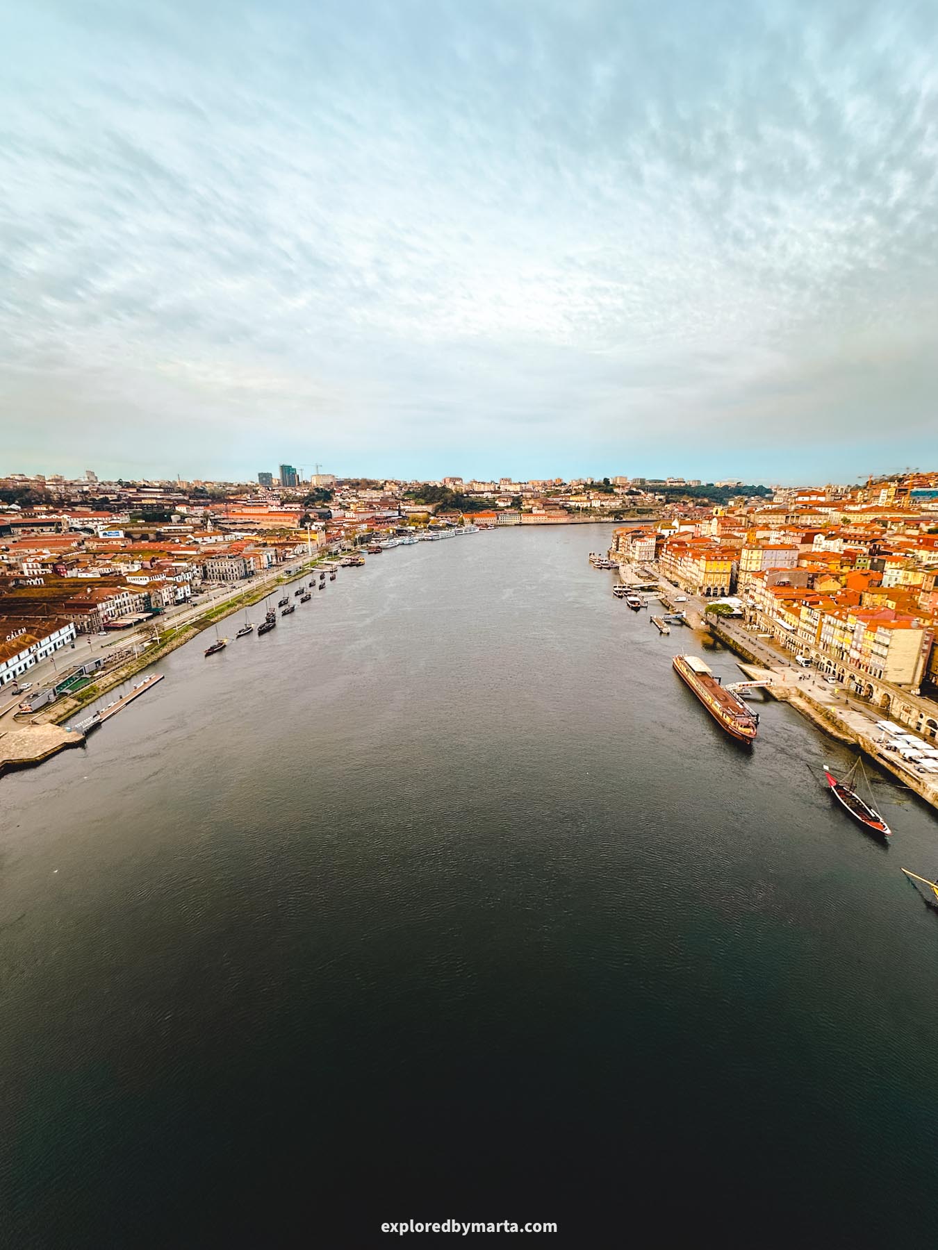 View of the Douro River from the upper deck of Dom Luís I Bridge in Porto, Portugal