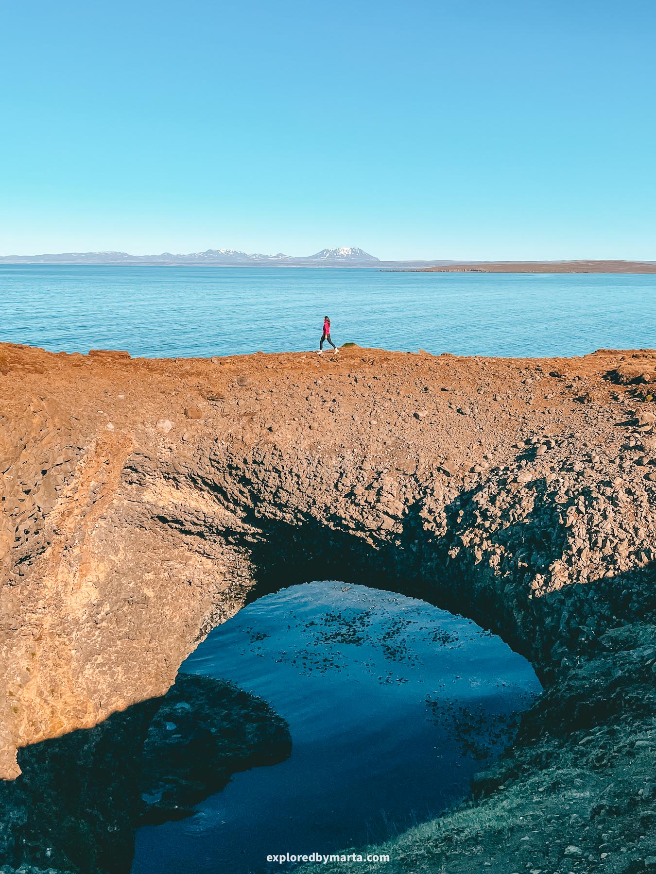 Gluggur Rock Bridge in Raudanes Point in North Iceland is one of the largest rock arches in Iceland