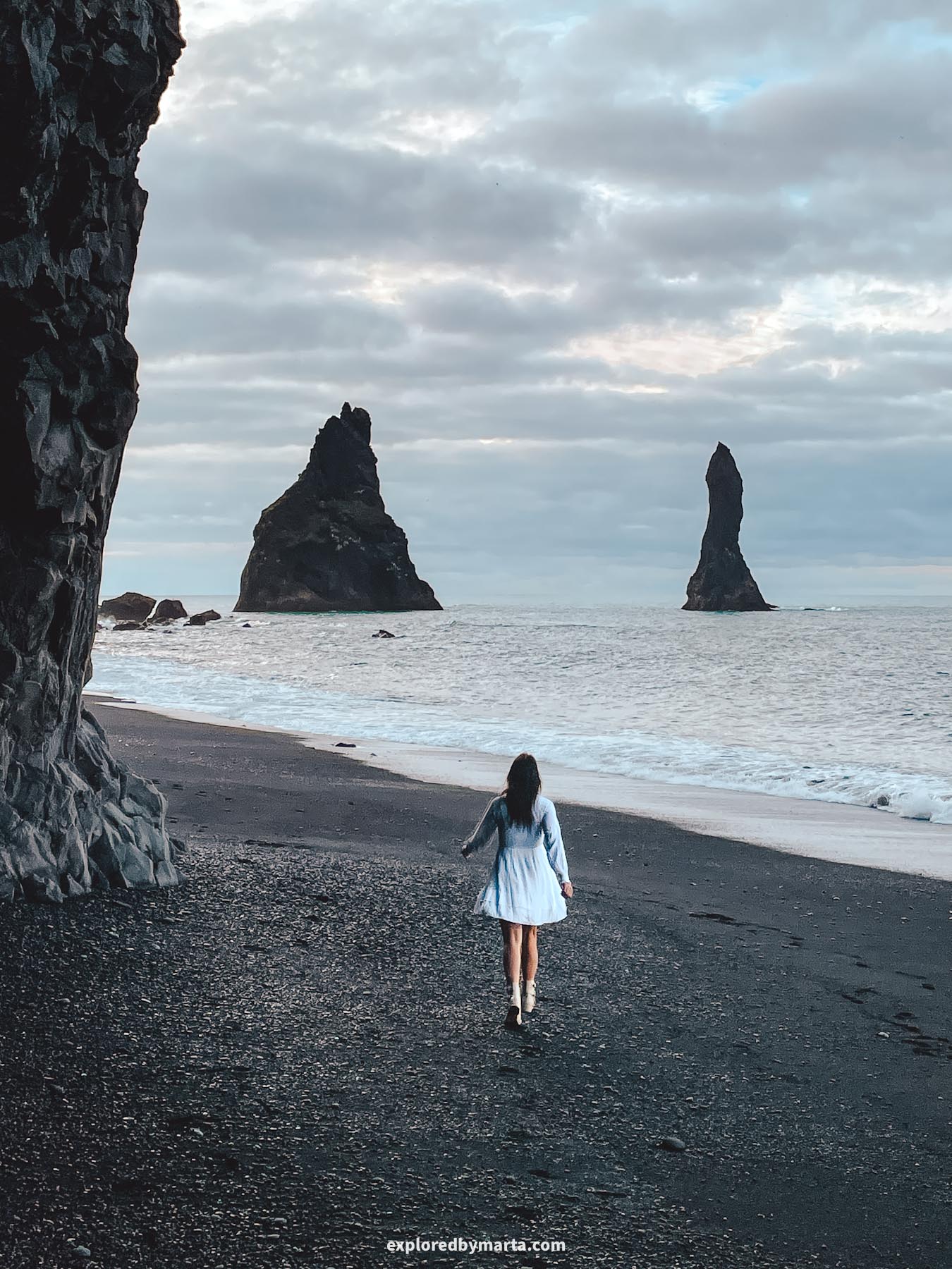 Reynisdrangar sea stacks in the Atlantic Ocean next to Reynisfjara black sand beach