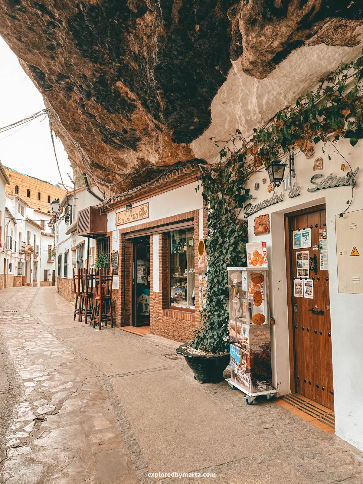 Cafes, shops and bars on Calle Cuevas de la Sombra in Setenil de las Bodegas cave village in Spain