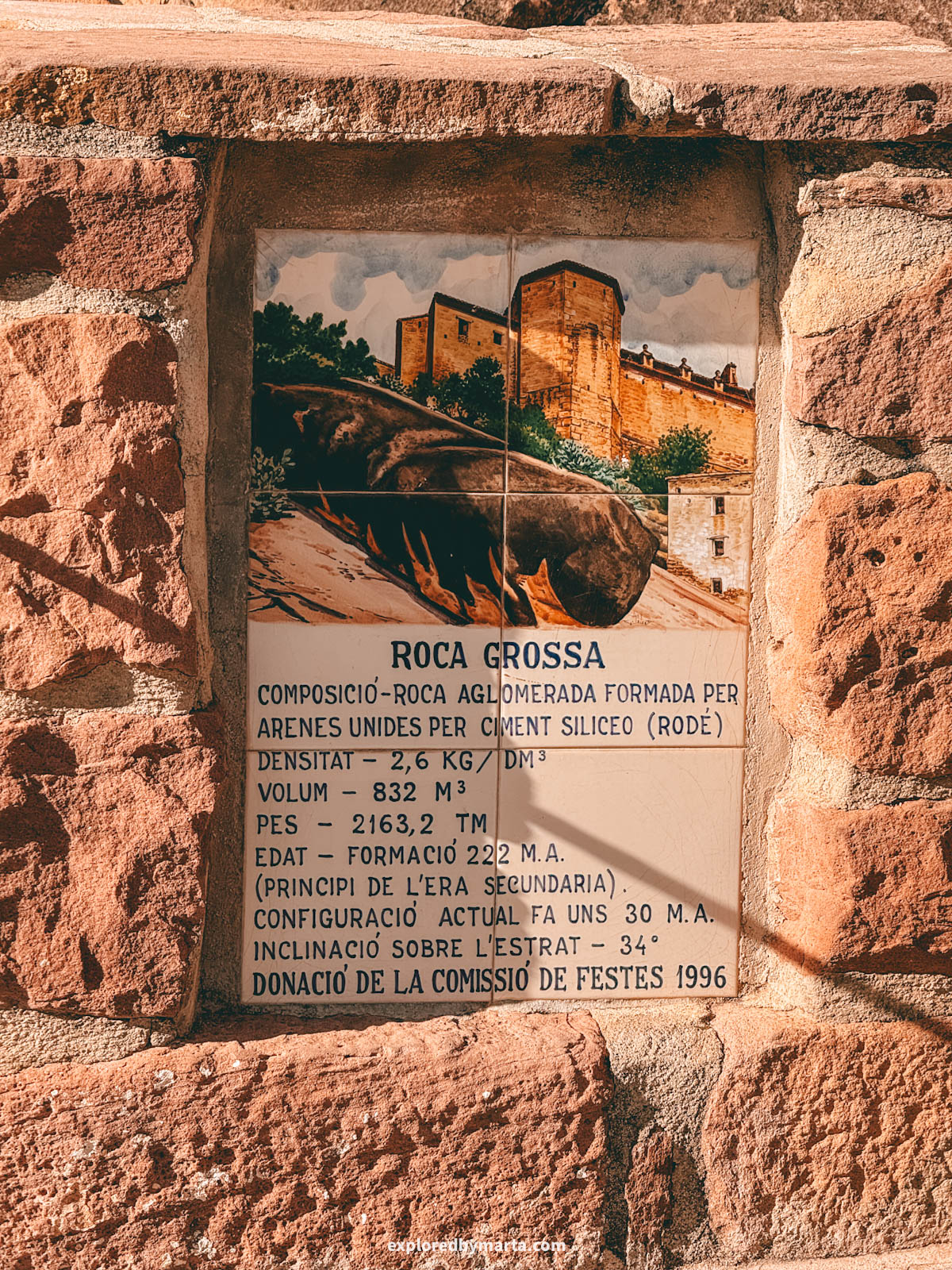 La Roca Grossa is a massive overhanging rock formation beneath a historic stone building in Vilafamés, Valencia Region, Spain