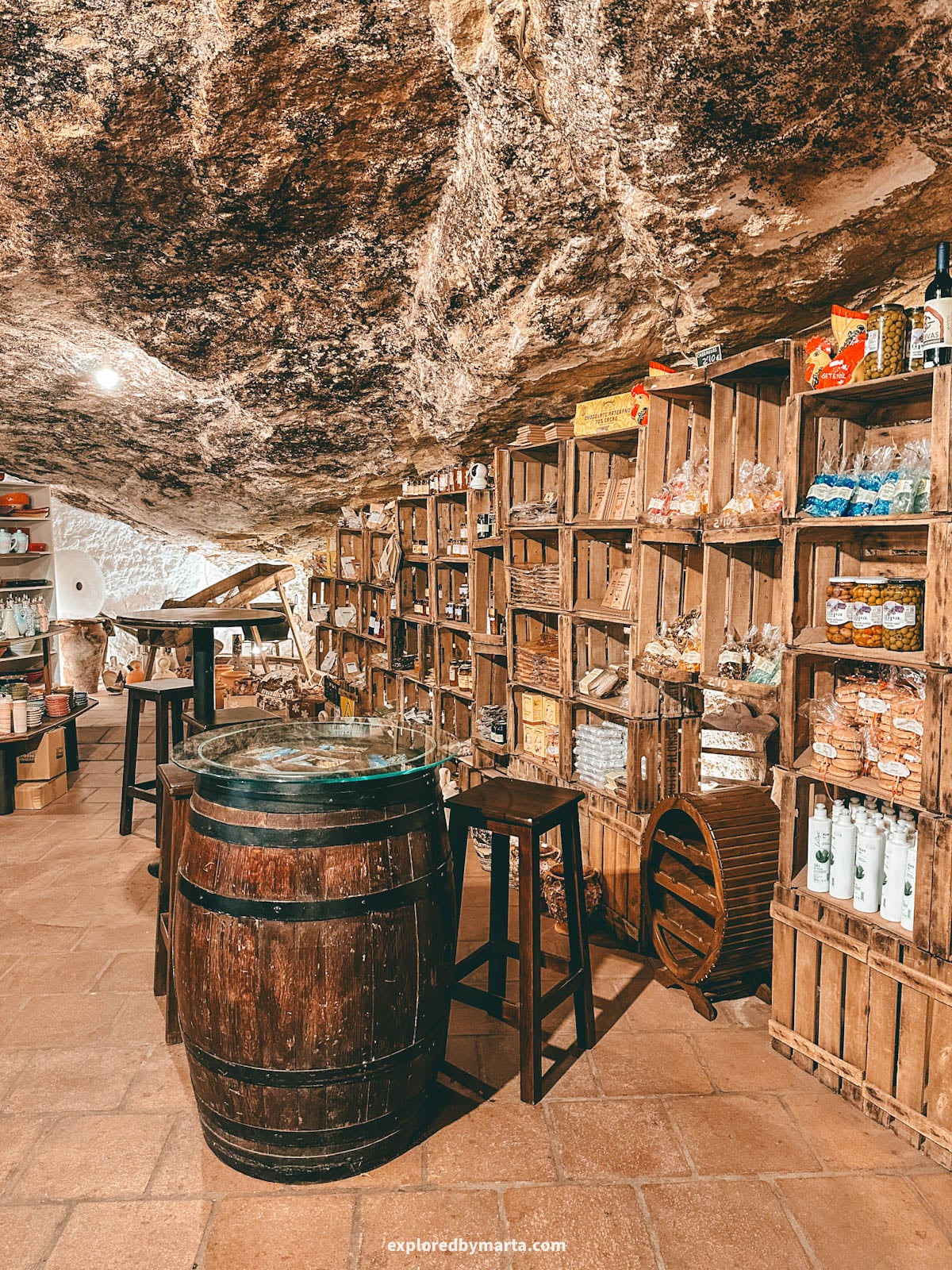 Shopping in Cueva Alta, the deepest cave in Setenil de las Bodegas cave village in Spain