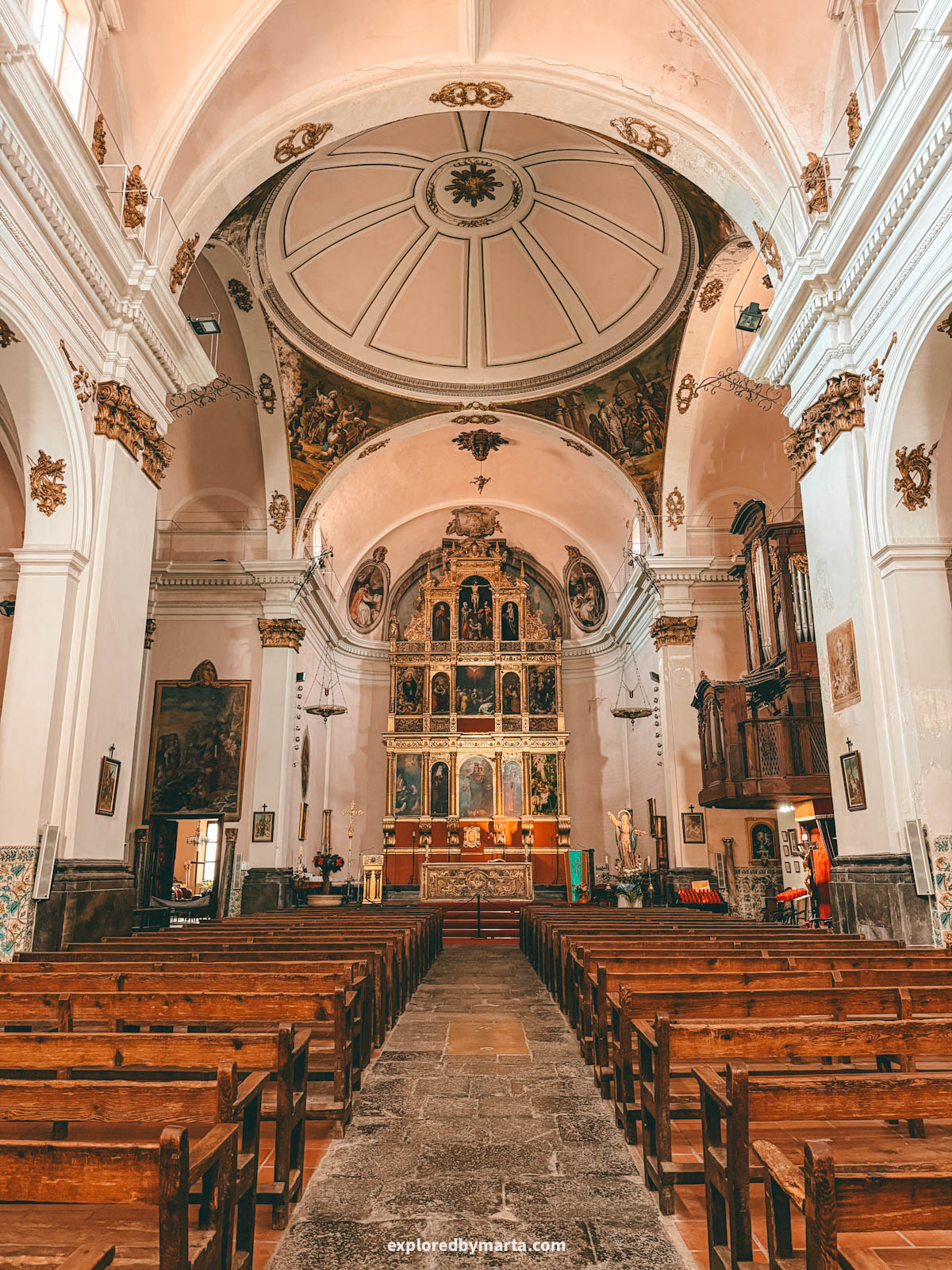 The beautiful interior of Santa María church in Vilafamés, Spain with simple altar and soft natural light