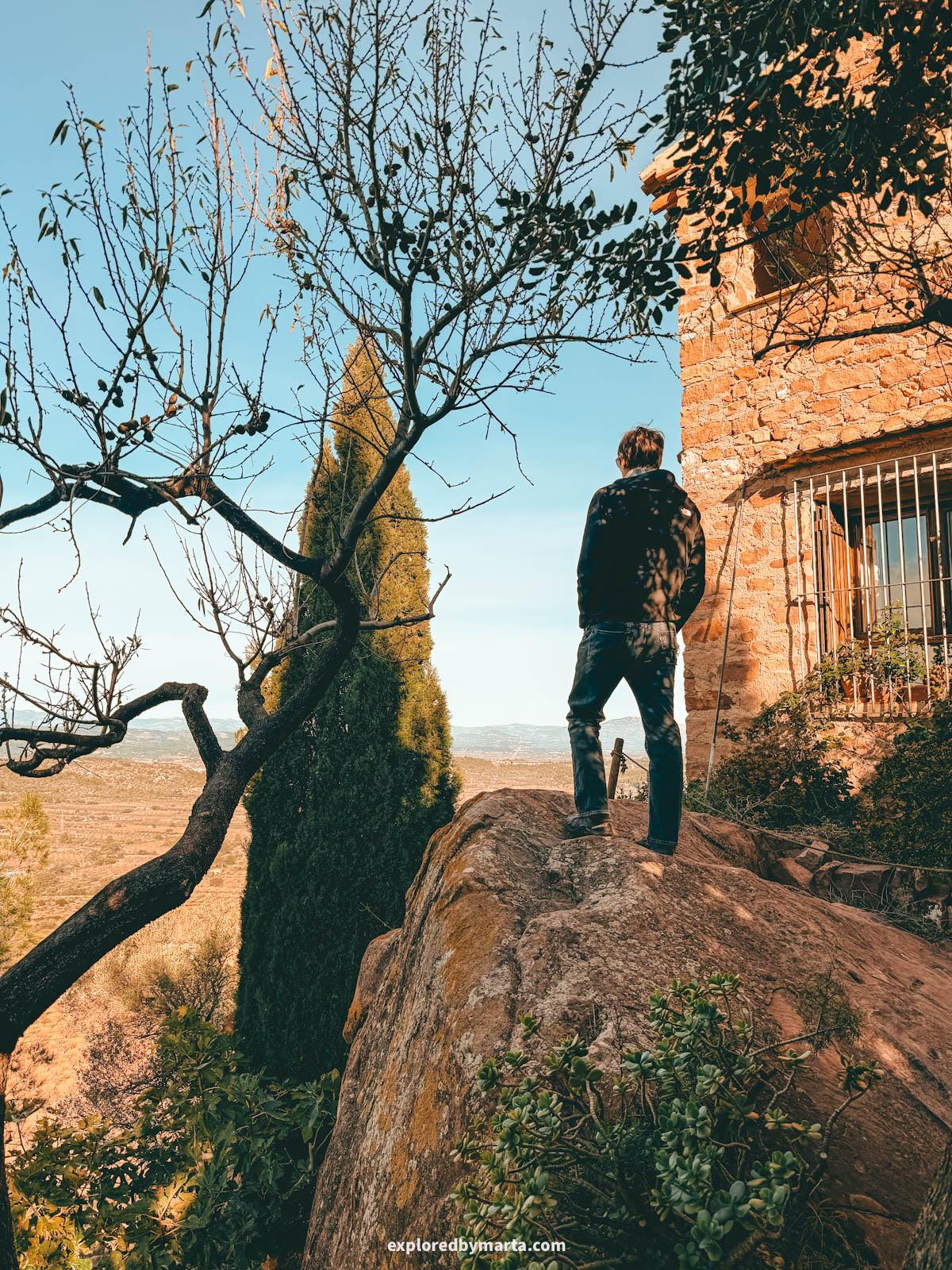 The most charming streets with flower pots and stone architecture in the historical neighbourhood of El Quartillo in Vilafamés, Valencia Region, Spain