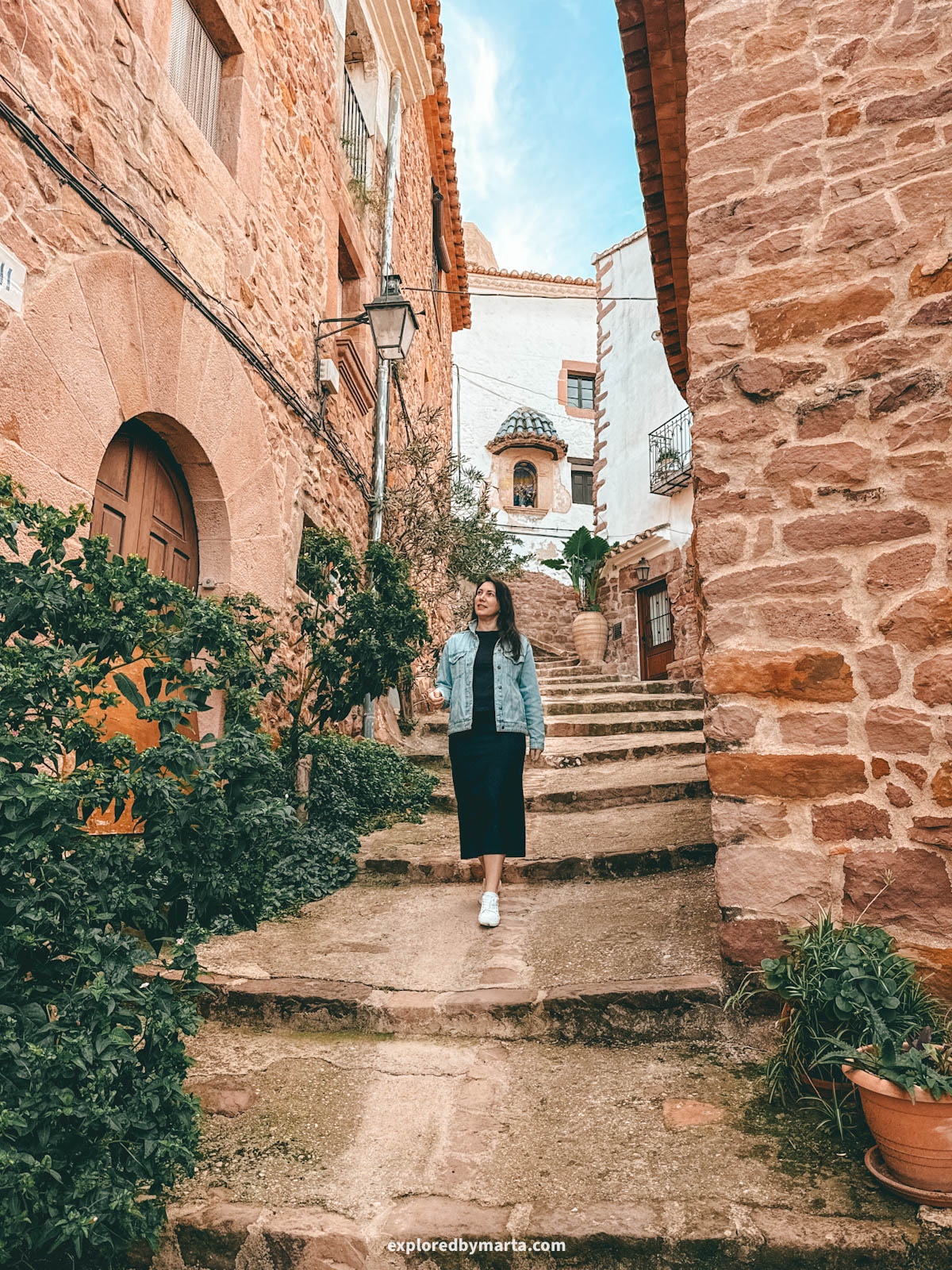 The most charming streets with flower pots and stone architecture in the historical neighbourhood of El Quartillo in Vilafamés, Valencia Region, Spain