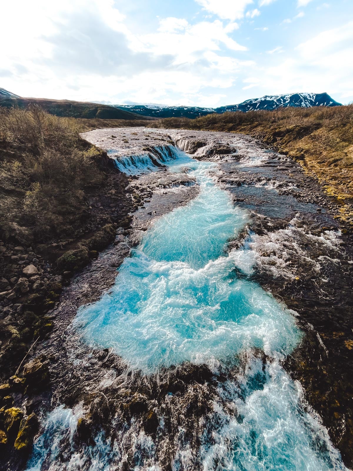 The vibrant blue Brúarfoss waterfall in Iceland