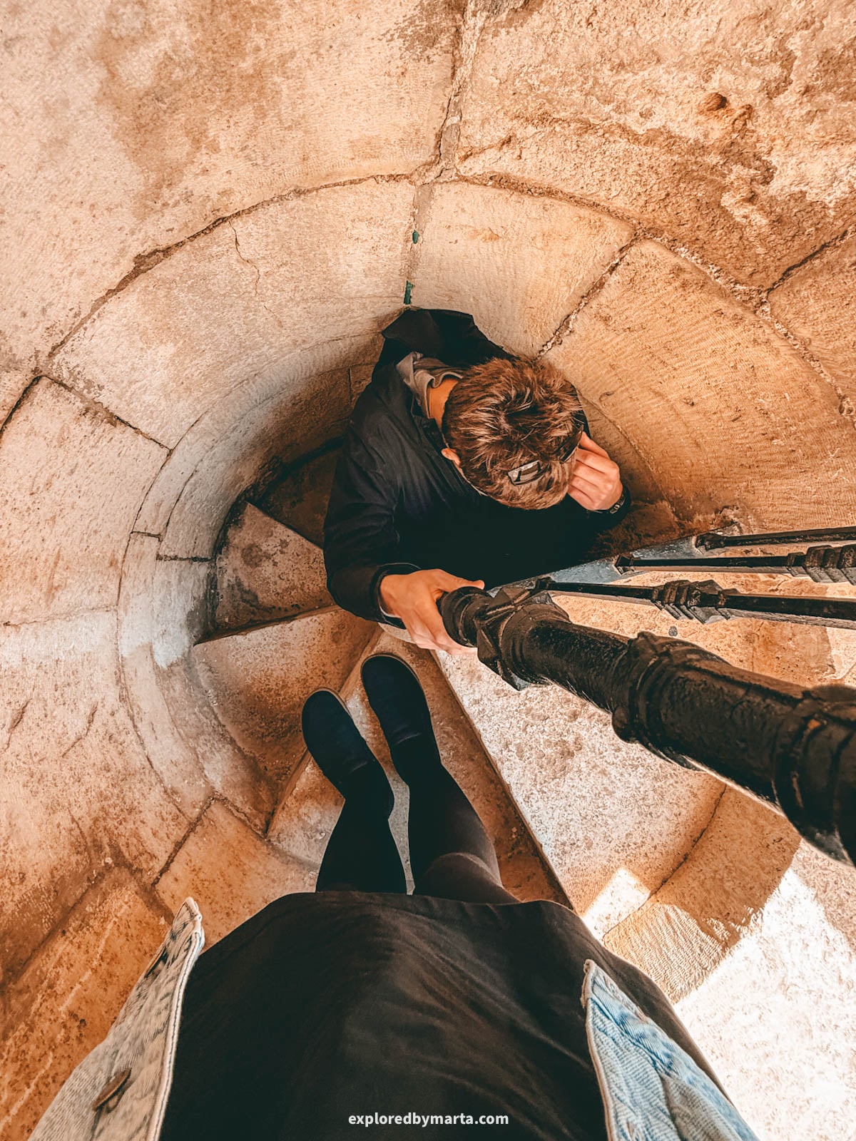 Admiring views over the old town when visiting the 69-meter bell tower of the Collegiate Basilica of Xàtiva, also known as La Seu, in Xativa, Spain