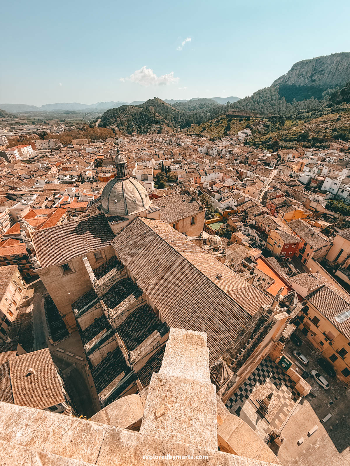 Admiring views over the old town when visiting the 69-meter bell tower of the Collegiate Basilica of Xàtiva, also known as La Seu, in Xativa, Spain