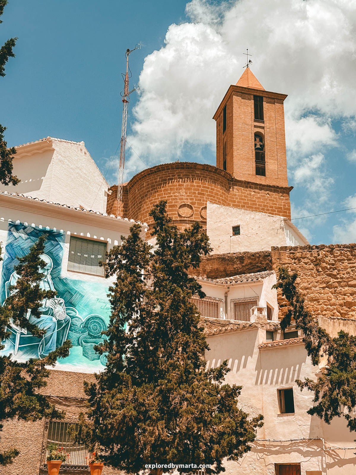 Santiago Apóstol Church seen from Plaza Nueva in Iznajar town in Andalusia, Spain