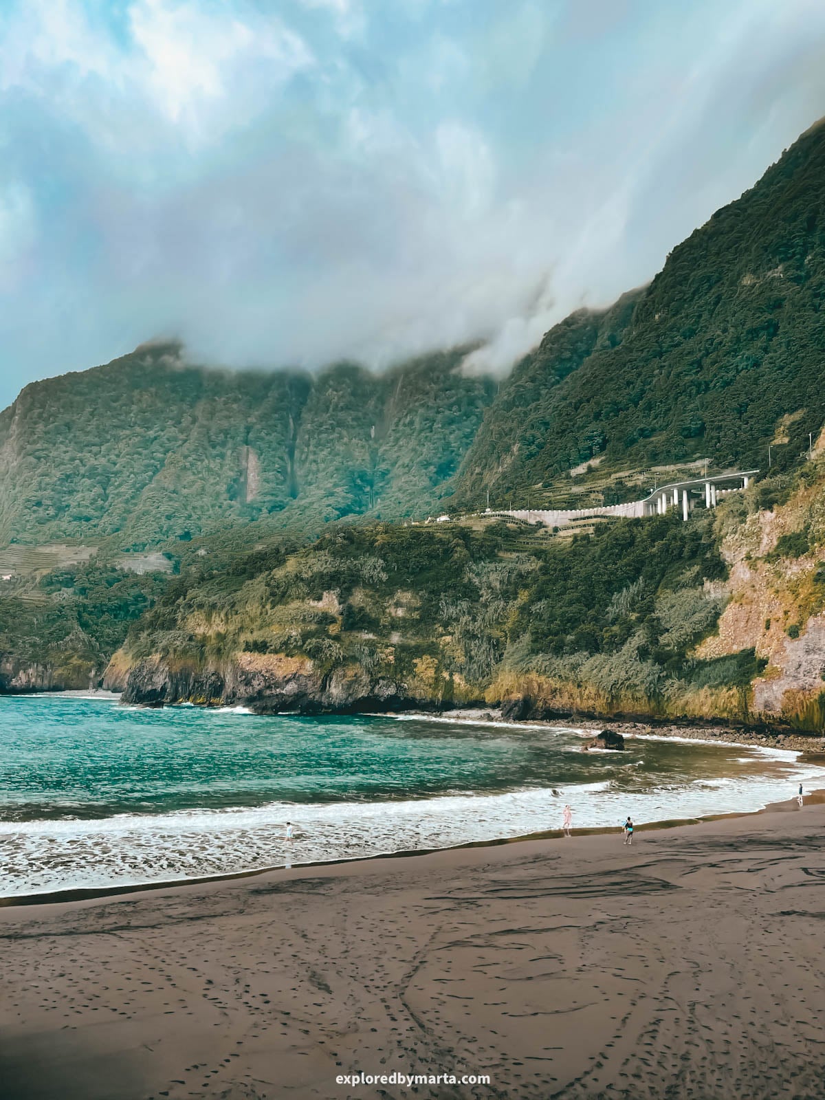 Seixal black sand beach with dramatic cliffs and waterfalls in Madeira, Portugal