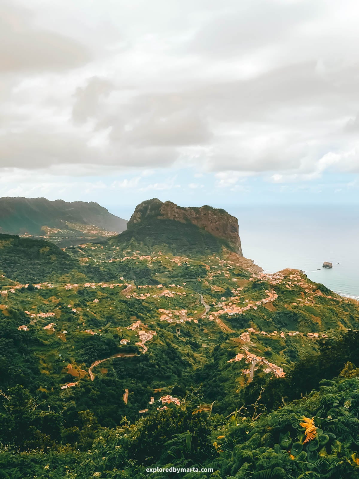 View of Porto da Cruz and Penha d’Águia, or Eagle Rock, from Miradouro da Portela in Madeira, Portugal