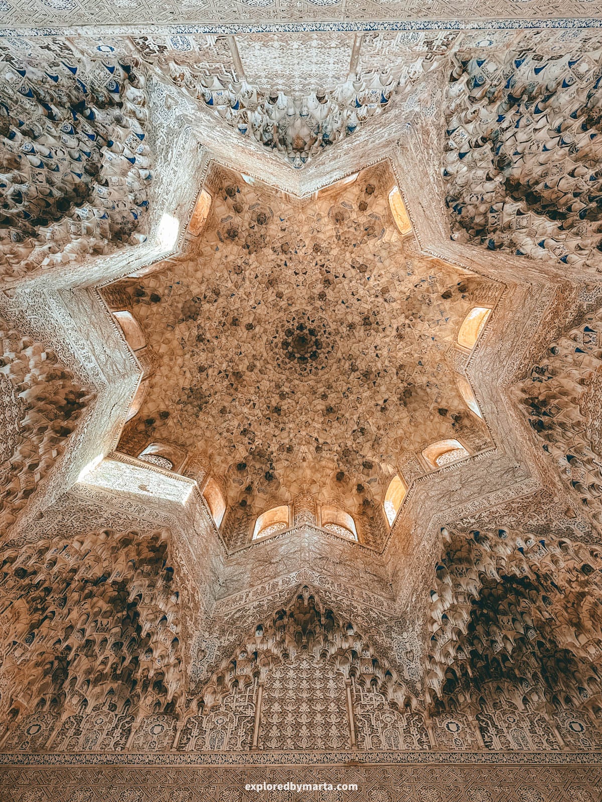 Amazing architecture inside the Nasrid Palaces in the Alhambra, Granada, Spain