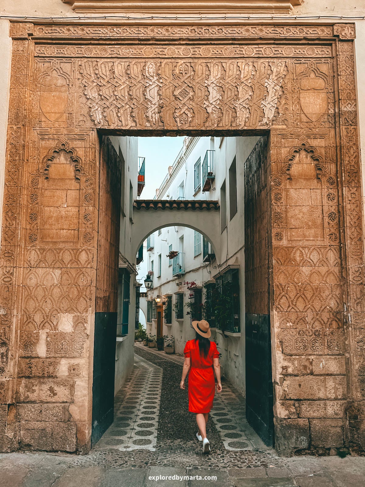 Callejón del Indiano is hidden street behind the doors of an old 15th-century palace facade in Córdoba, Spain