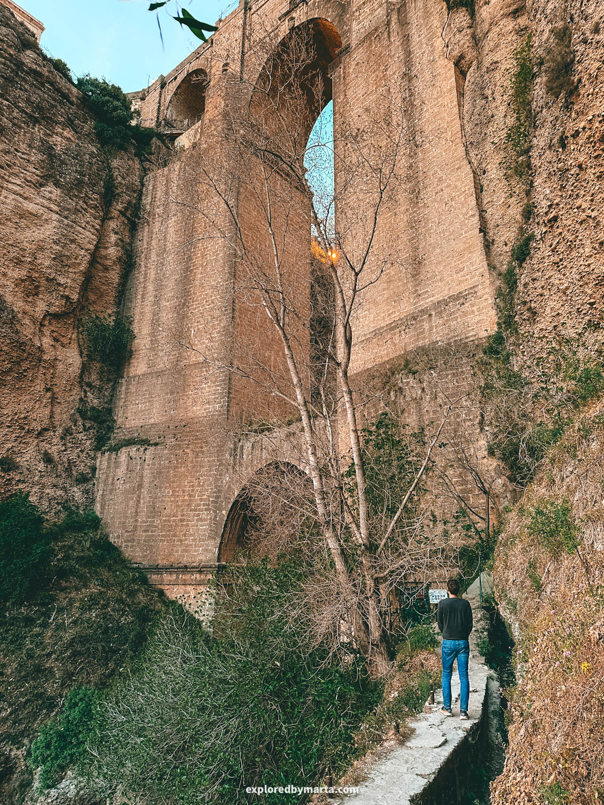 Camino del Desfiladero del Tajo goes down to the base of Puente Nuevo bridge in Ronda, Spain