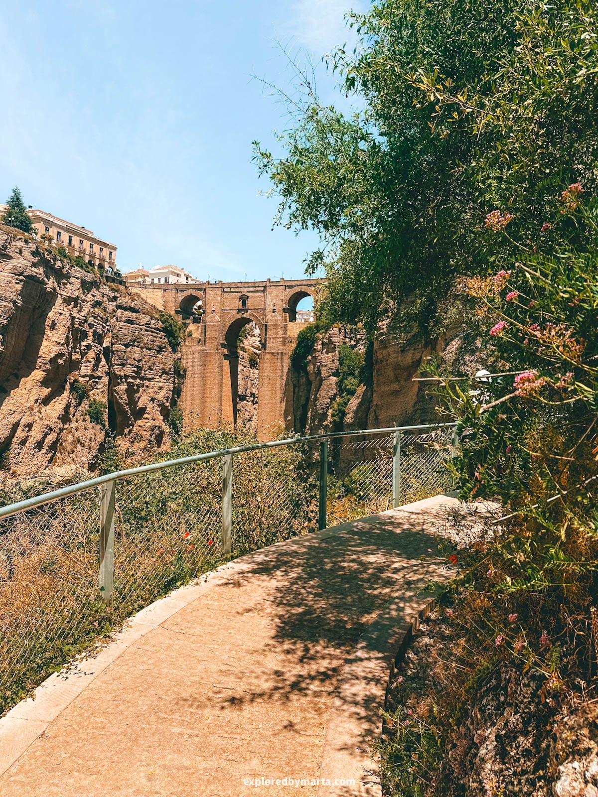 Camino del Desfiladero del Tajo goes down to the base of Puente Nuevo bridge in Ronda, Spain