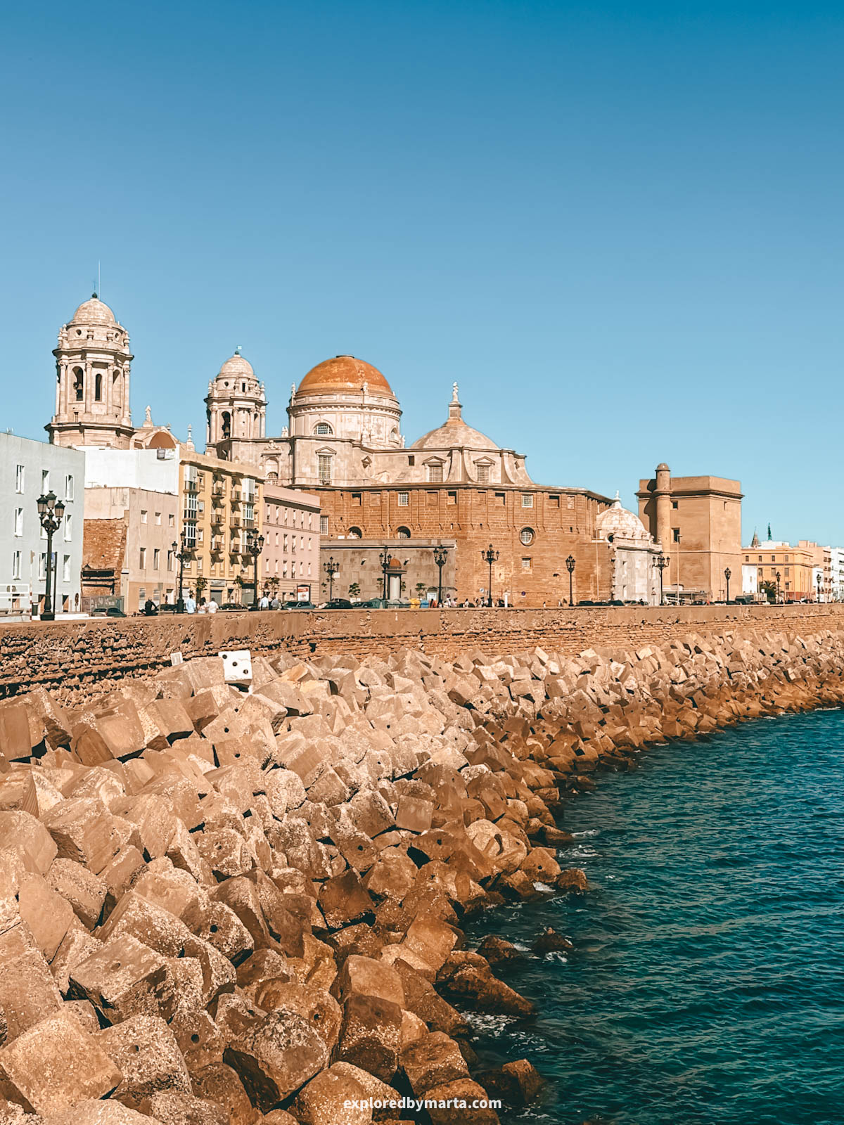Iconic view of the Catedral de Cádiz from Campo del Sur seaside promenade in Cádiz, Spain
