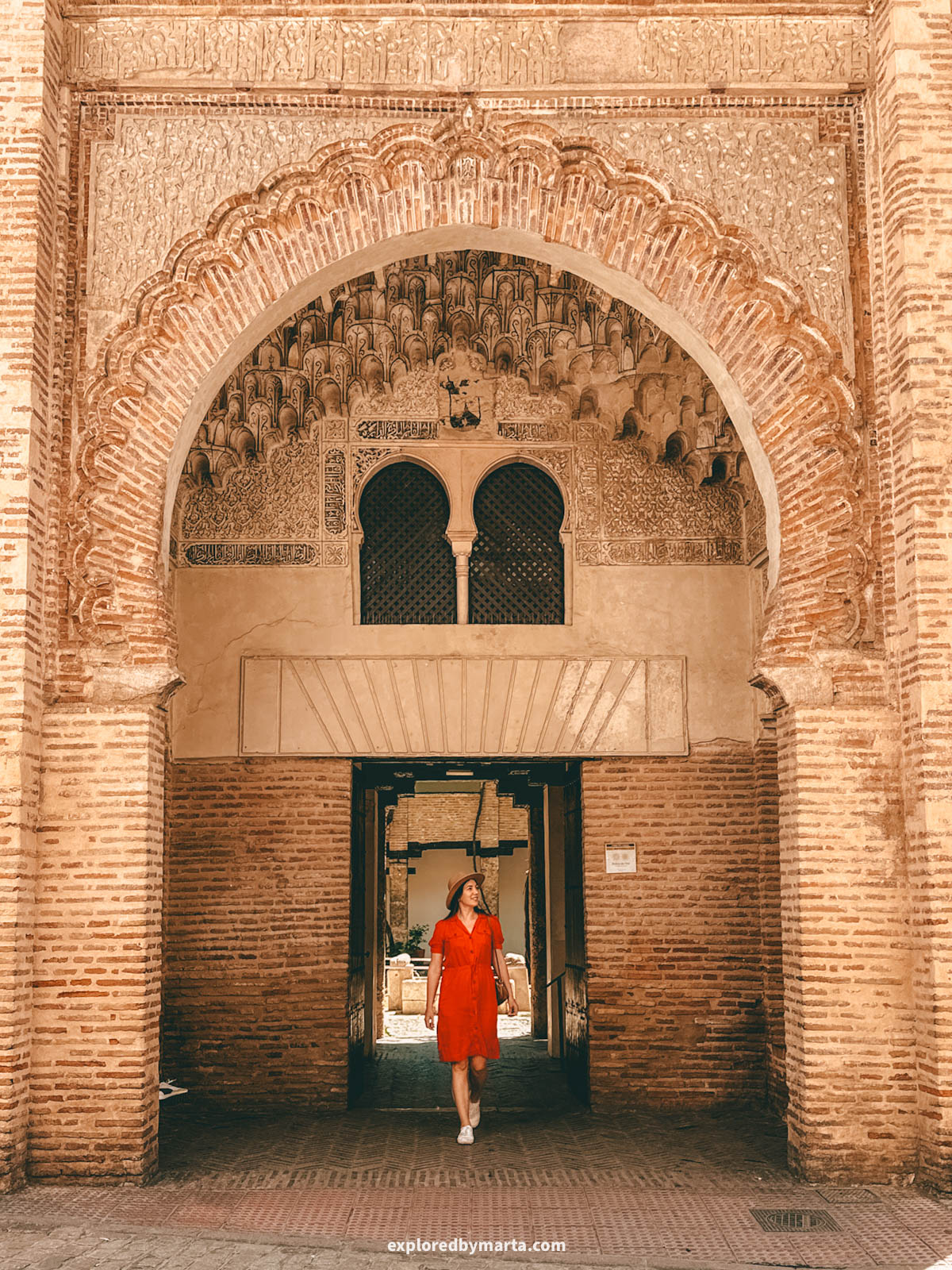 Moorish horseshoe arch entrance to Corral del Carbón in Granada