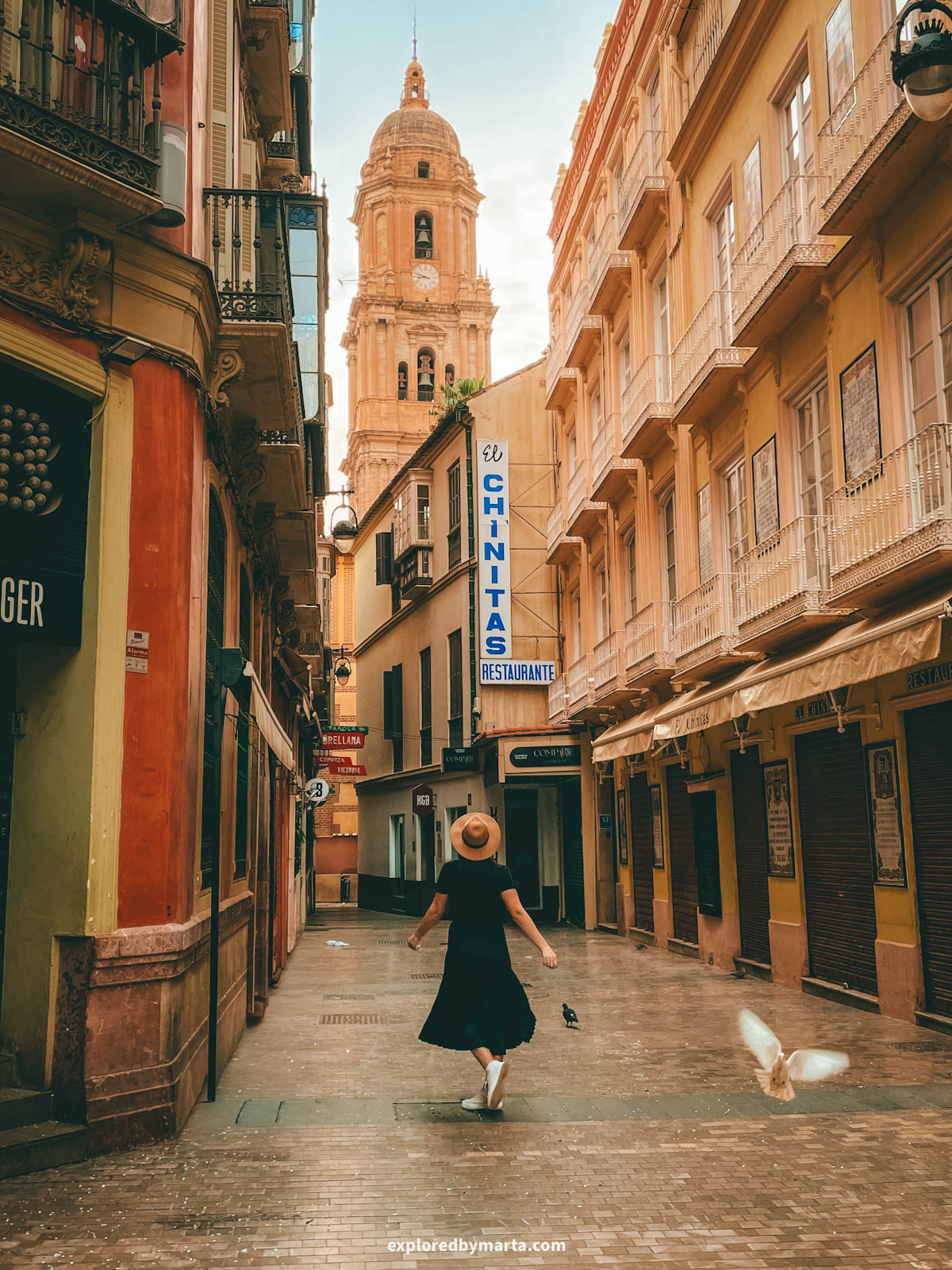 Tower of Malaga Cathedral seen from Calle Moreno Monroy in Malaga, Spain