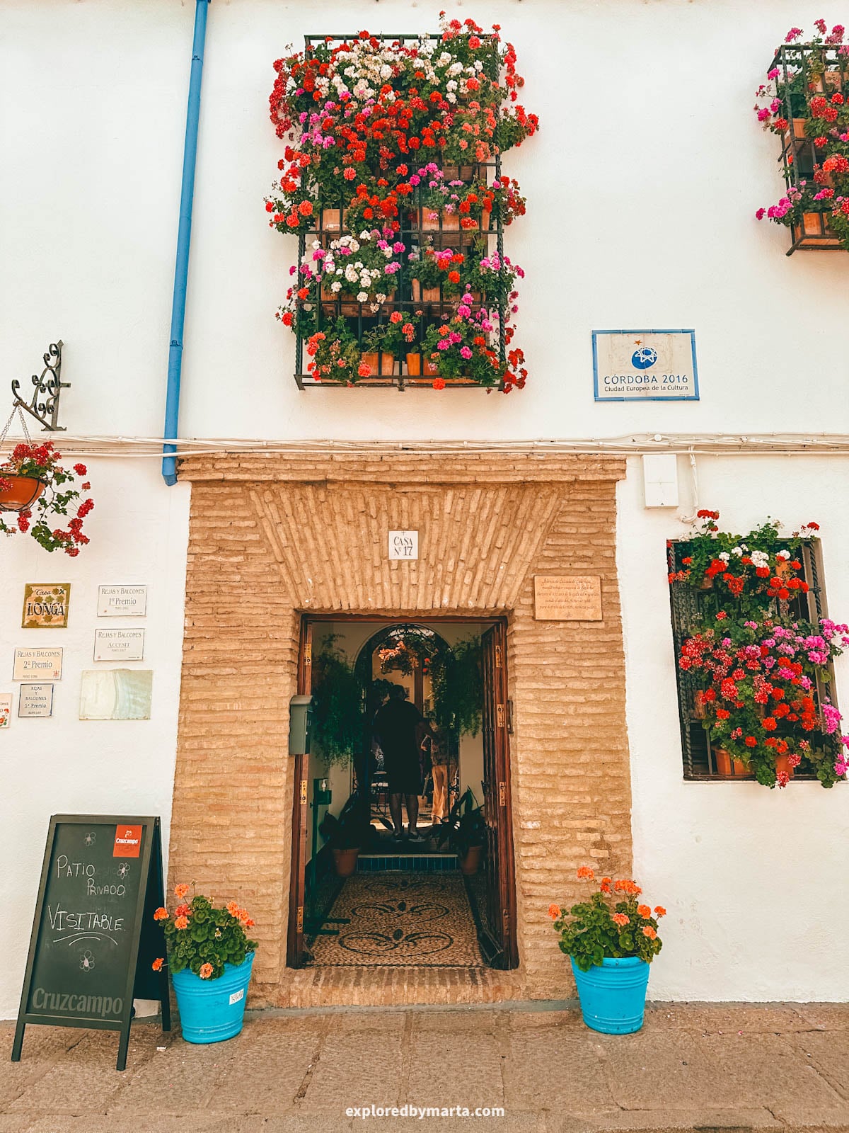 Visiting the famous flower courtyards Patios de Córdoba in San Basilio neighborhood in Córdoba, Spain