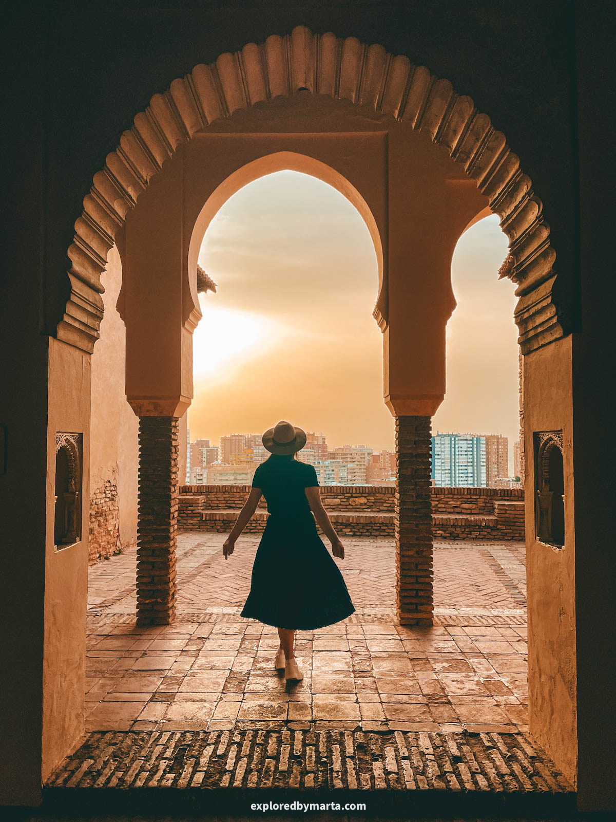Morning sun through arches at Alcazaba de Málaga in Malaga, Spain