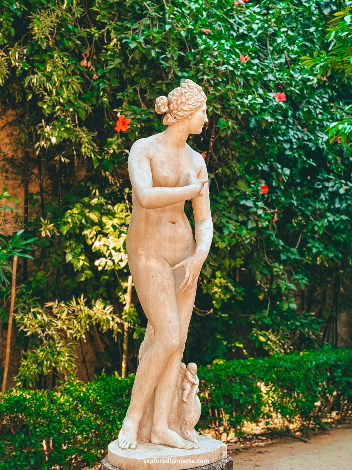 Blooming gardens at Palacio de las Dueñas in Seville, Spain