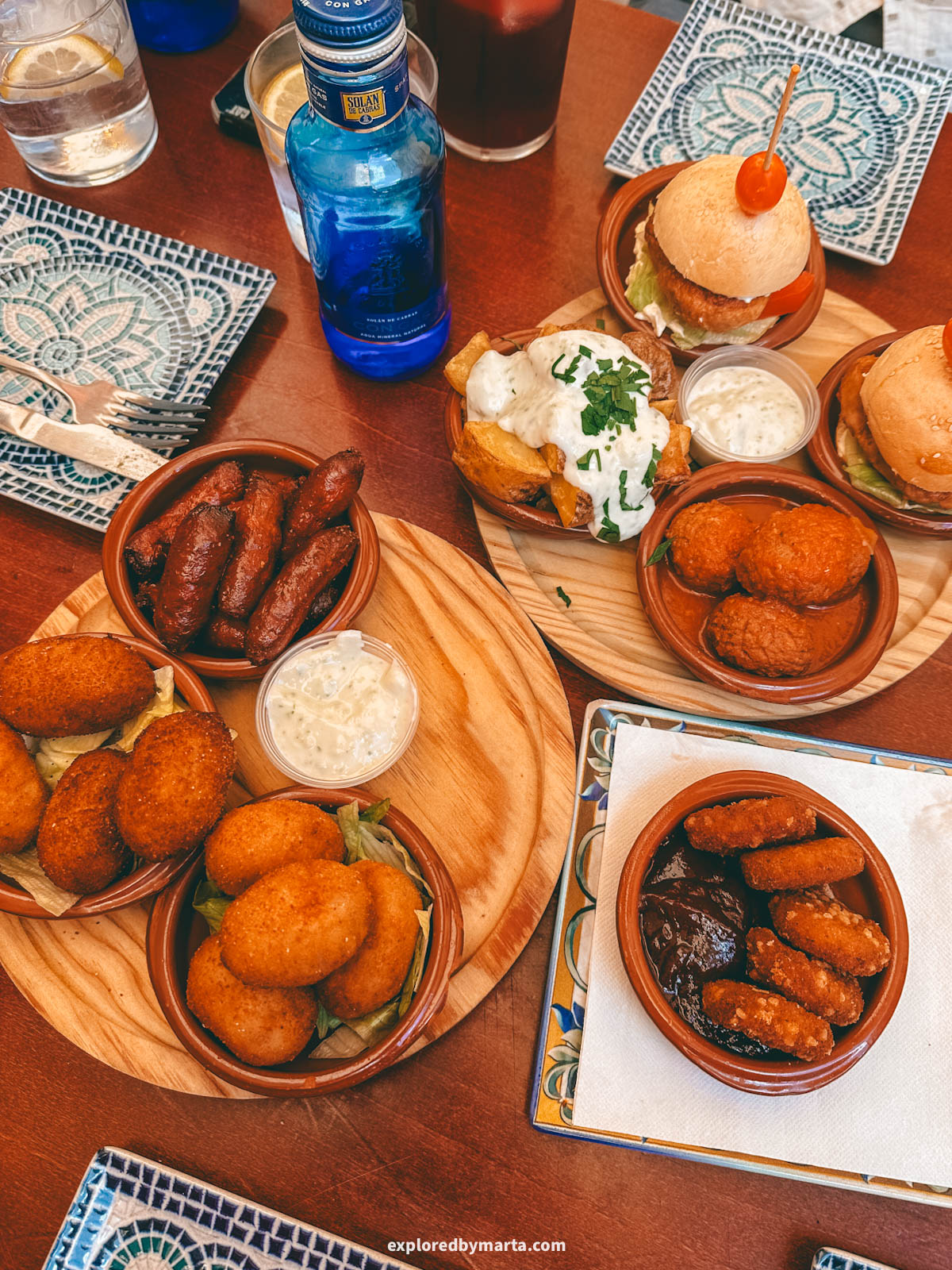 Eating Spanish tapas at Picasso Bar Tapas, right on the lively Plaza de la Merced square in Malaga, Spain
