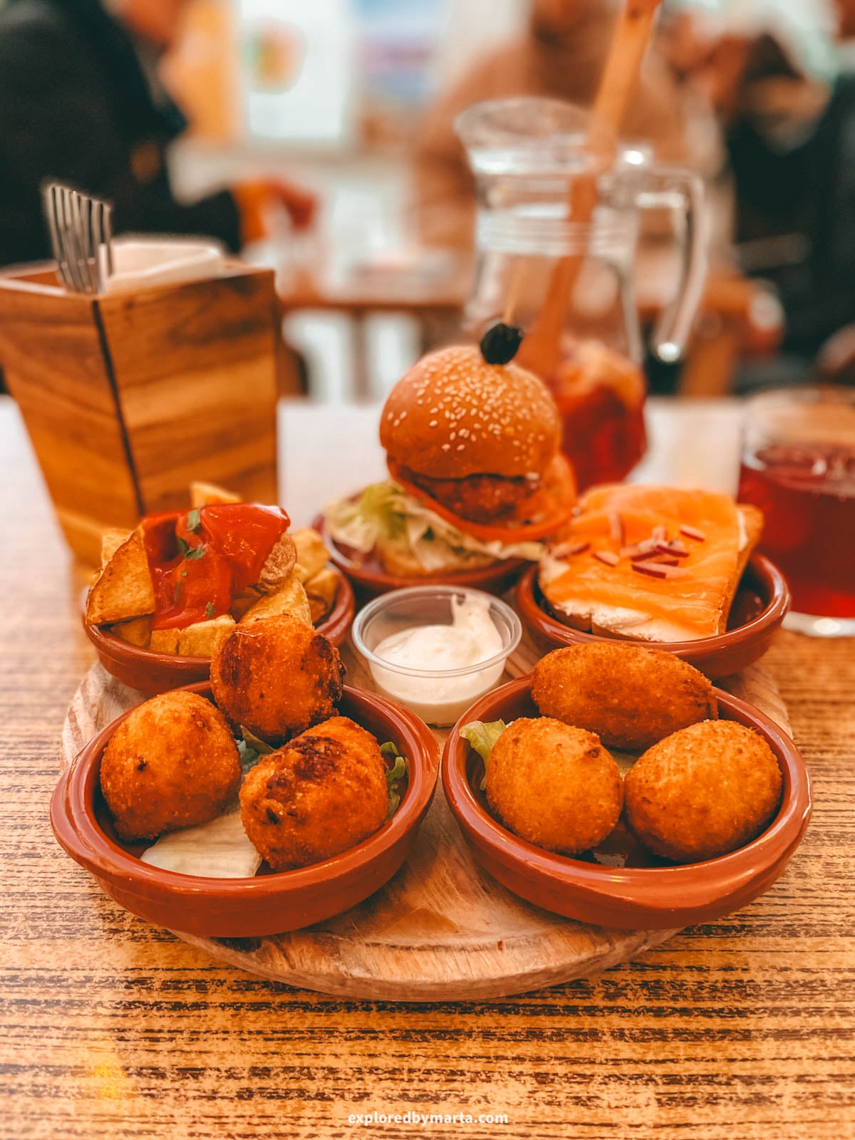 Eating Spanish tapas at Picasso Bar Tapas, right on the lively Plaza de la Merced square in Malaga, Spain