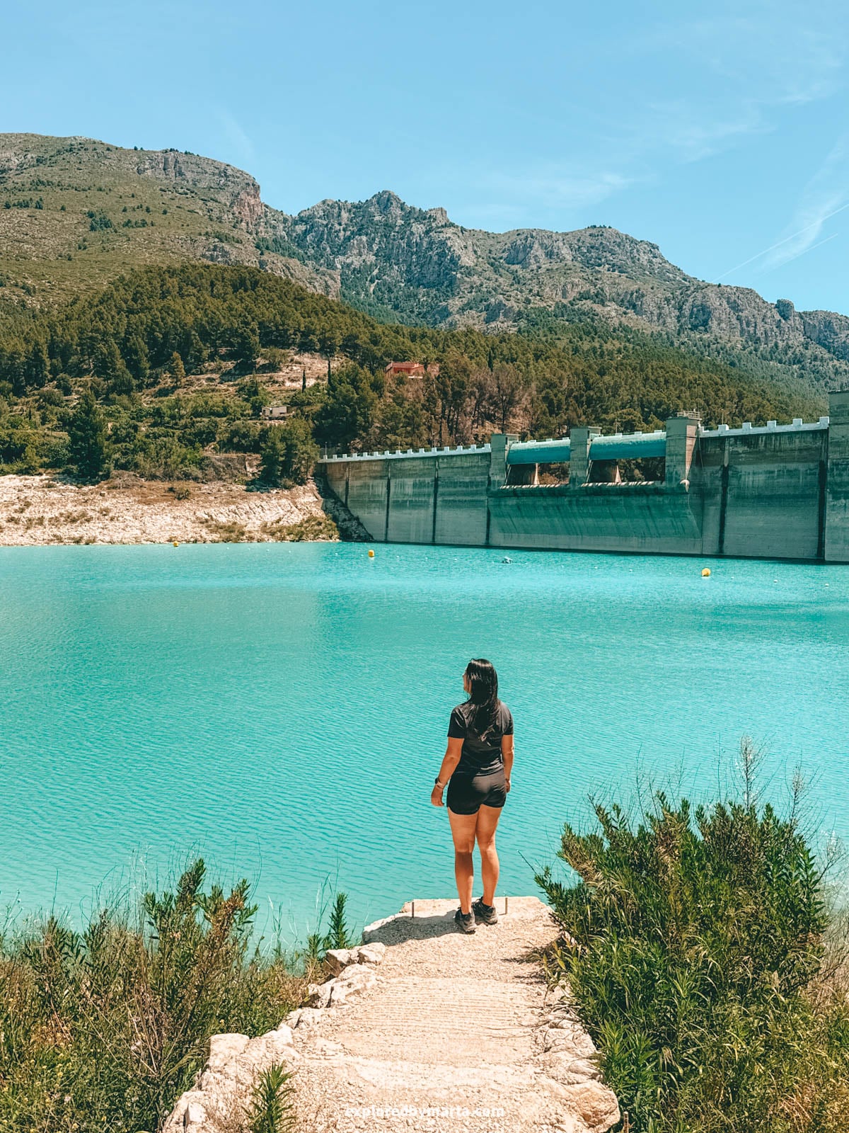 Hiking around the turquoise Guadalest reservoir in Valencia Region, Spain