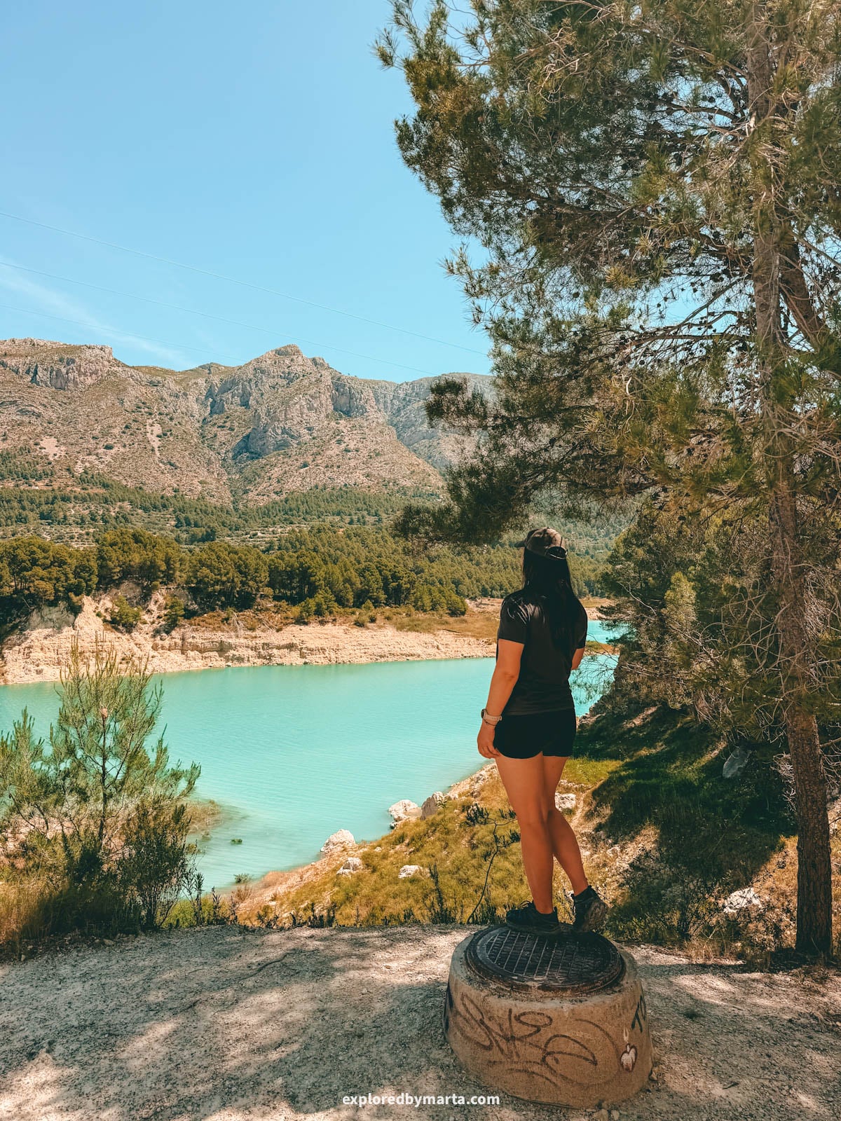 Hiking around the turquoise Guadalest reservoir in Valencia Region, Spain