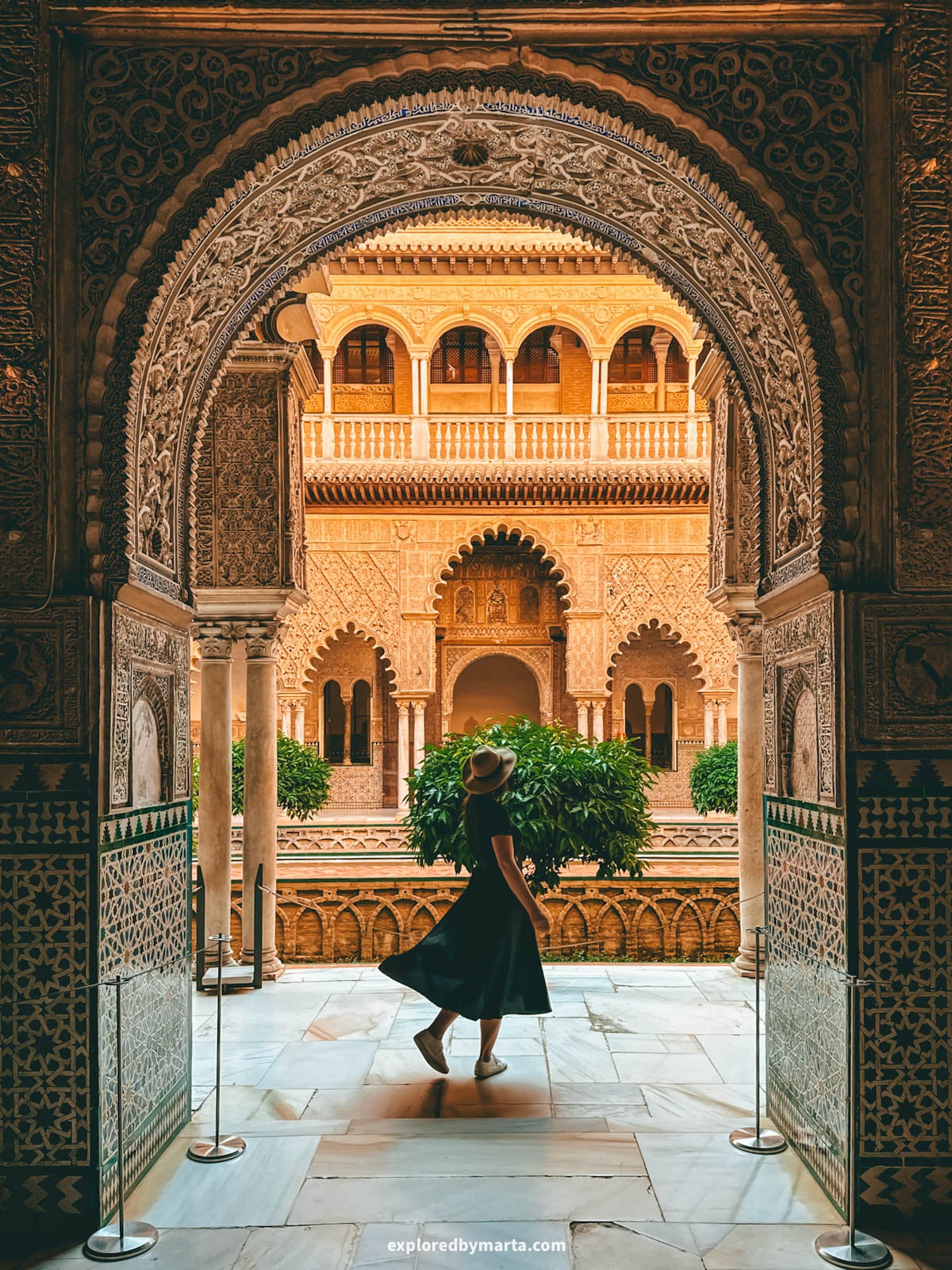 Mudéjar tilework and carved arches at the Patio de las Doncellas in Royal Alcázar of Seville, Spain