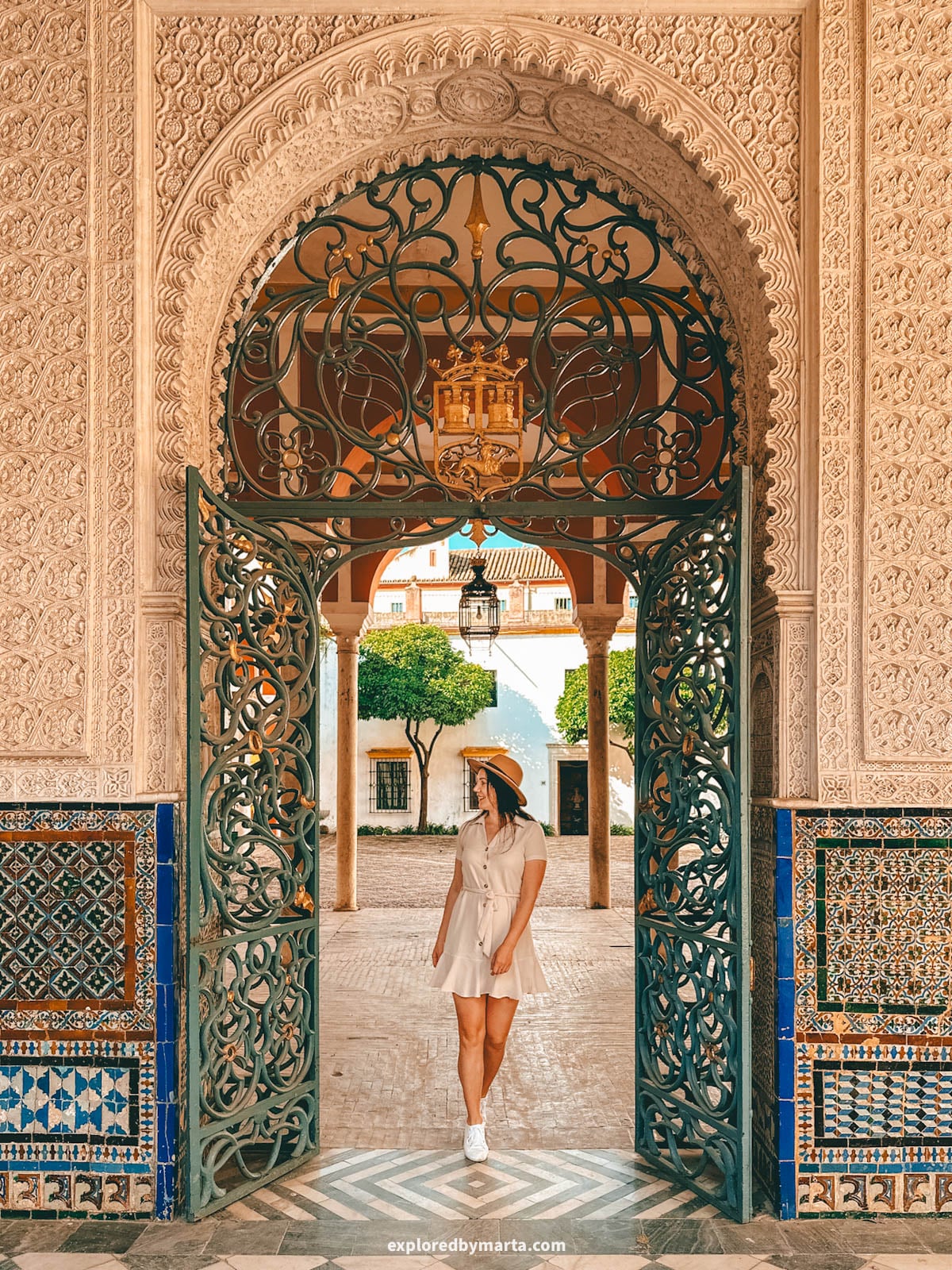 The central courtyard with arches and tilework at Casa de Pilatos in Seville, Spain