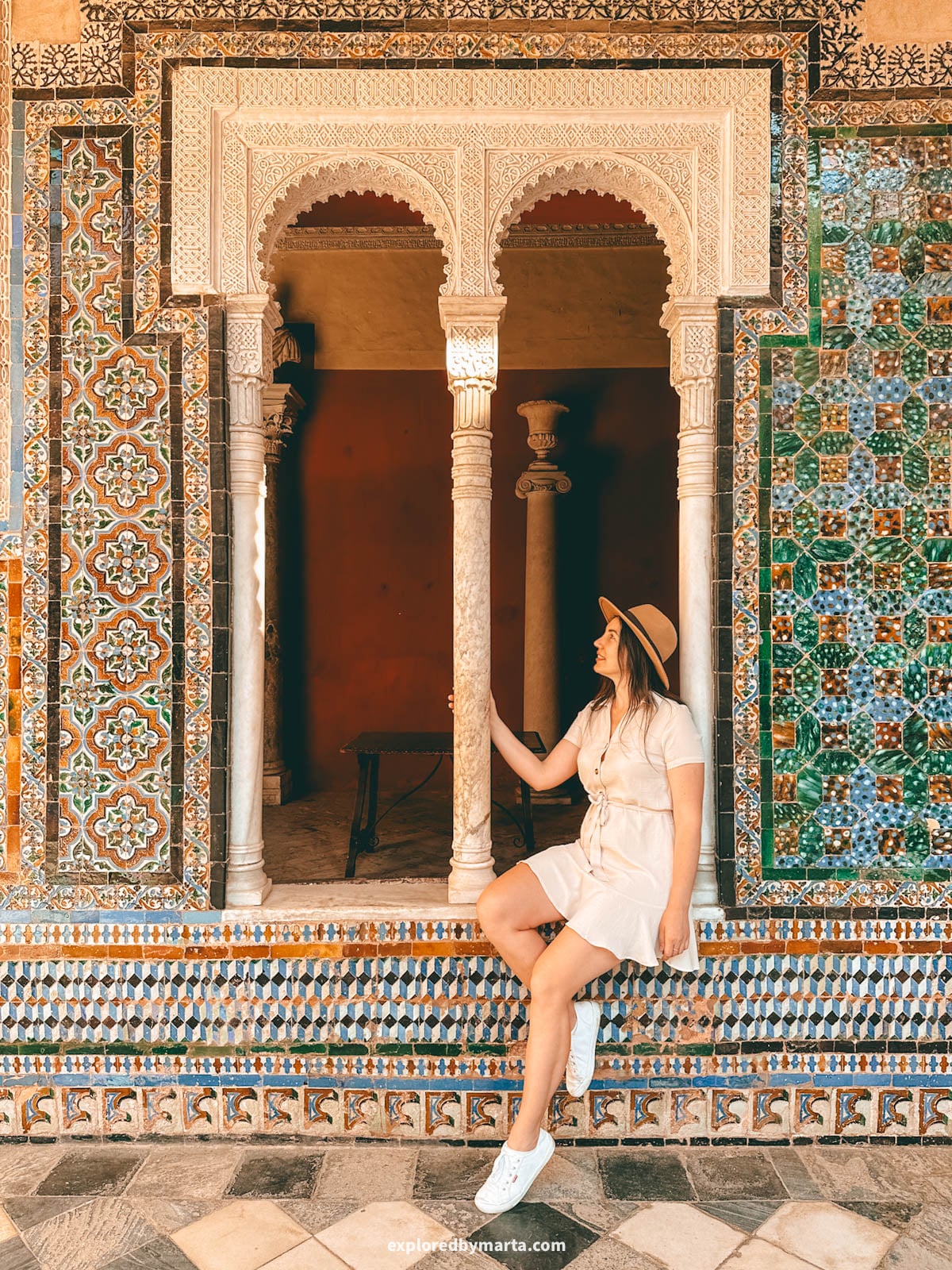 The central courtyard with arches and tilework at Casa de Pilatos in Seville, Spain