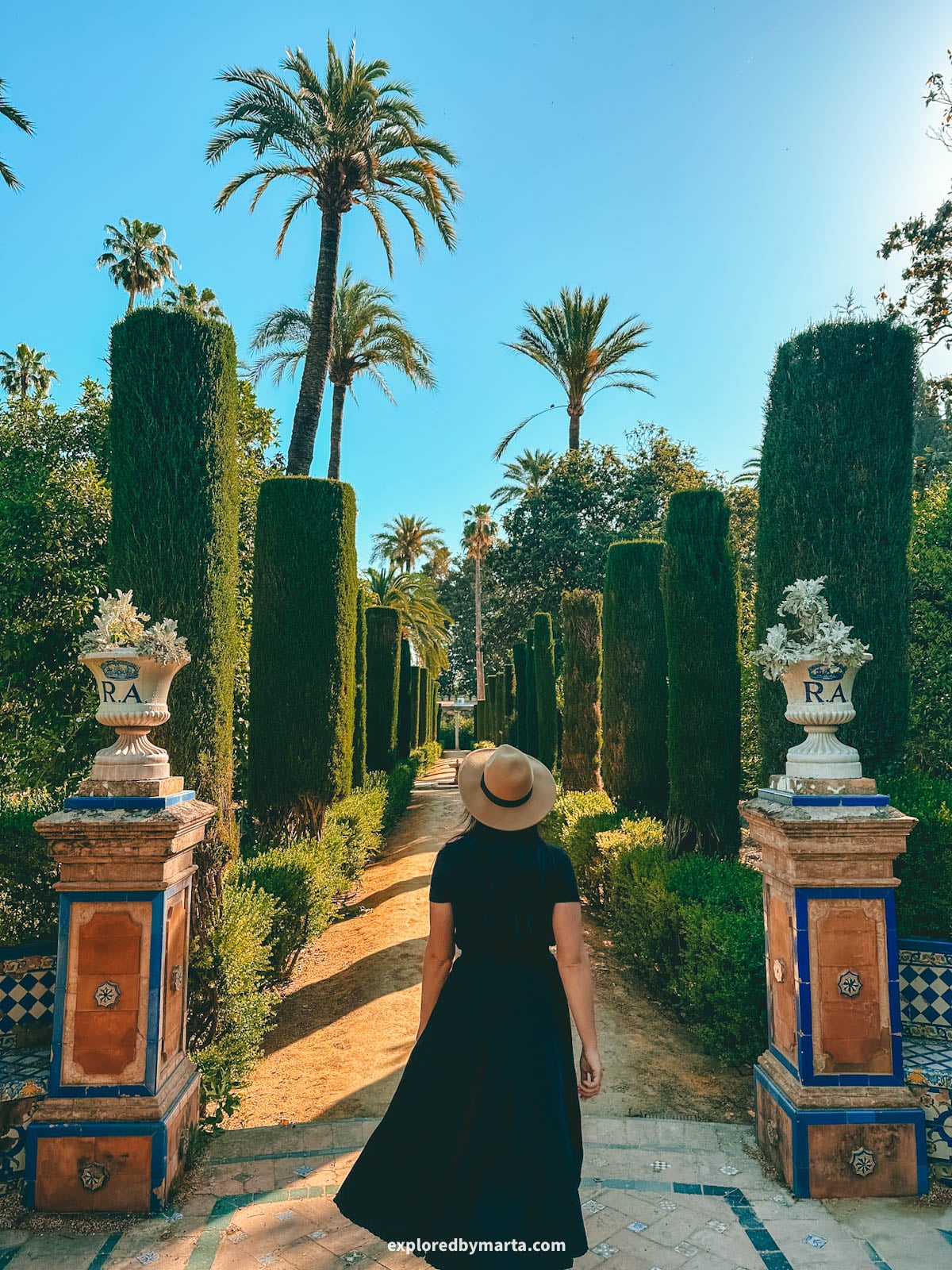 The palm-lined gardens of the Royal Alcázar of Seville, Spain