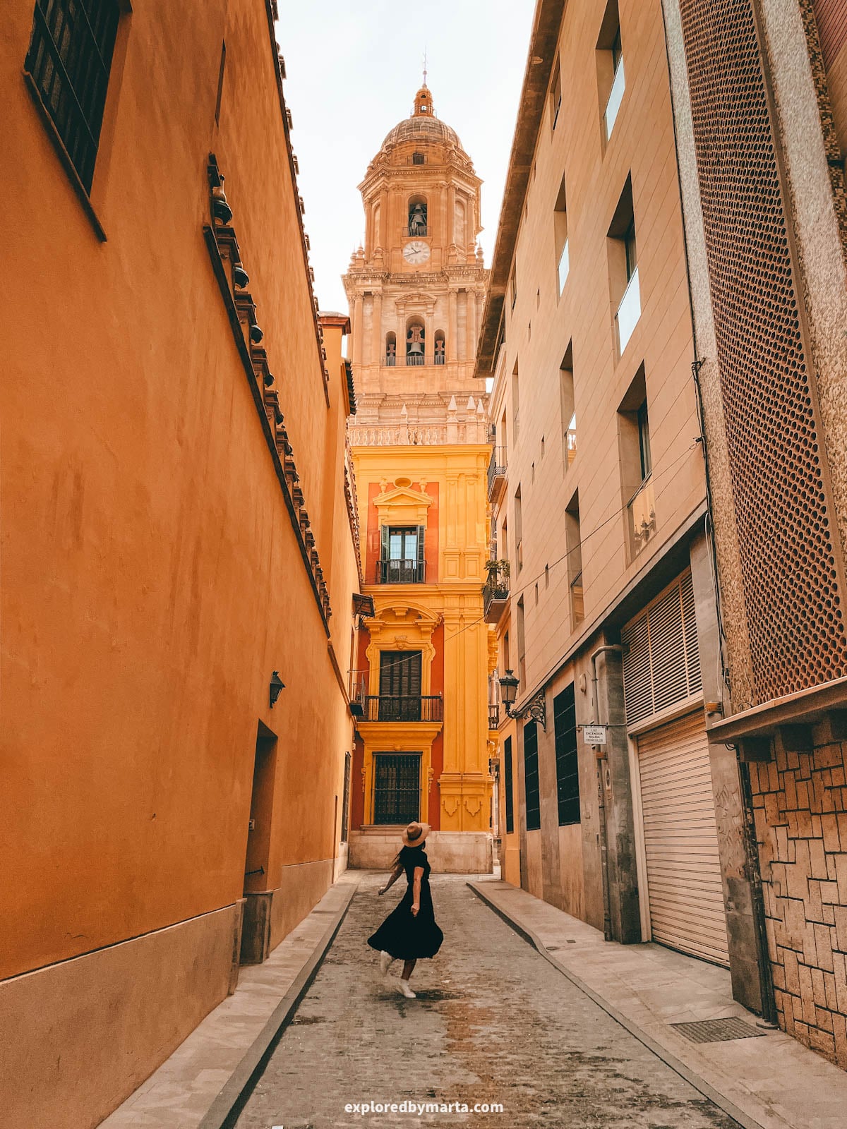 Tower of Malaga Cathedral seen from Calle Salinas in Malaga, Spain