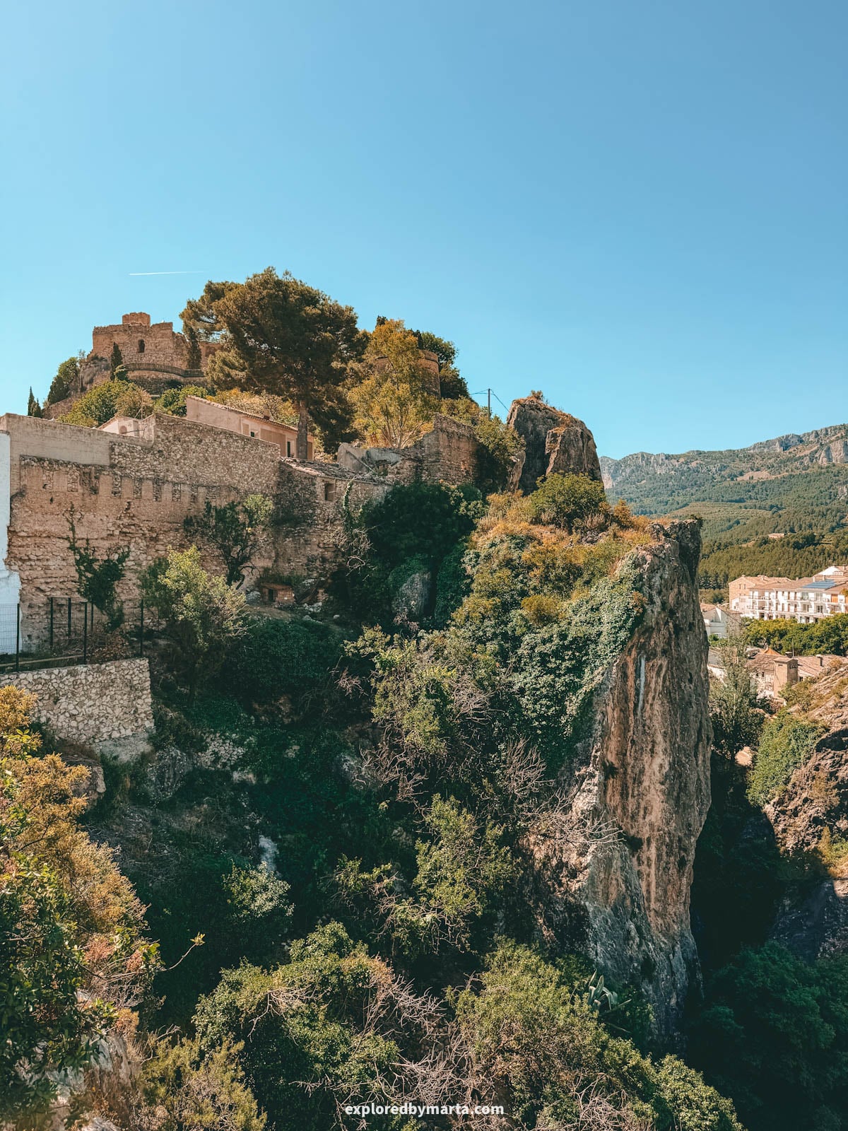 View of the San Jose Castle from Mirador des de la Muralla viewpoint in Guadalest, Spain