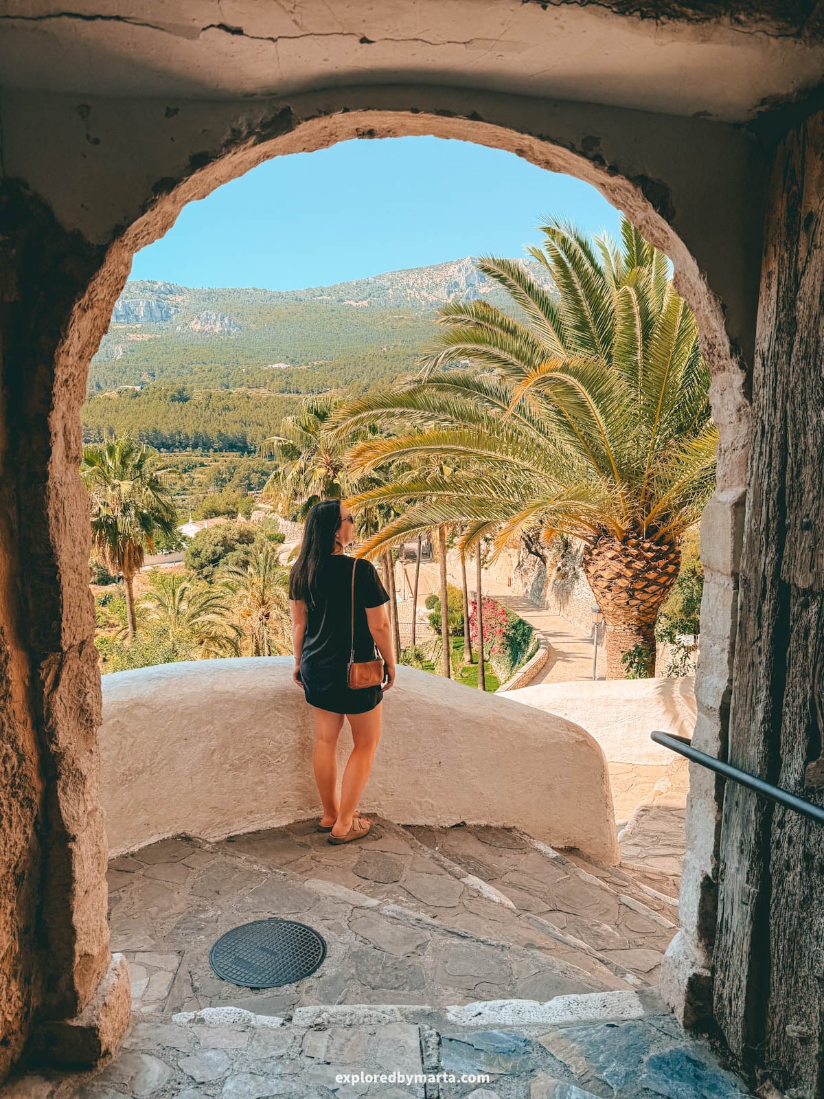 View through the Portal de Sant Josep tunnel into the old town of Guadalest, Spain