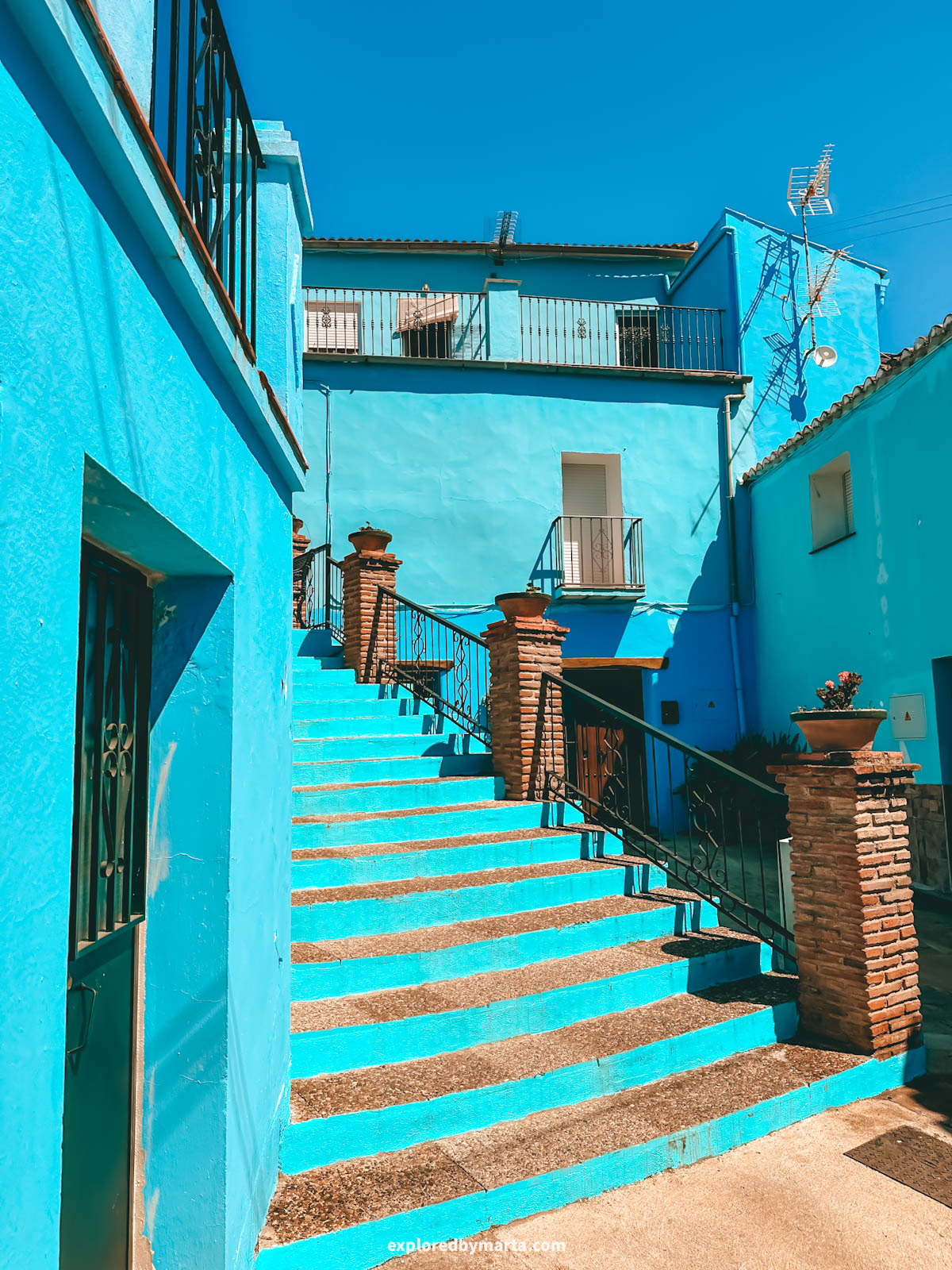Beautiful blue painted stairs in Juzcar village in Spain