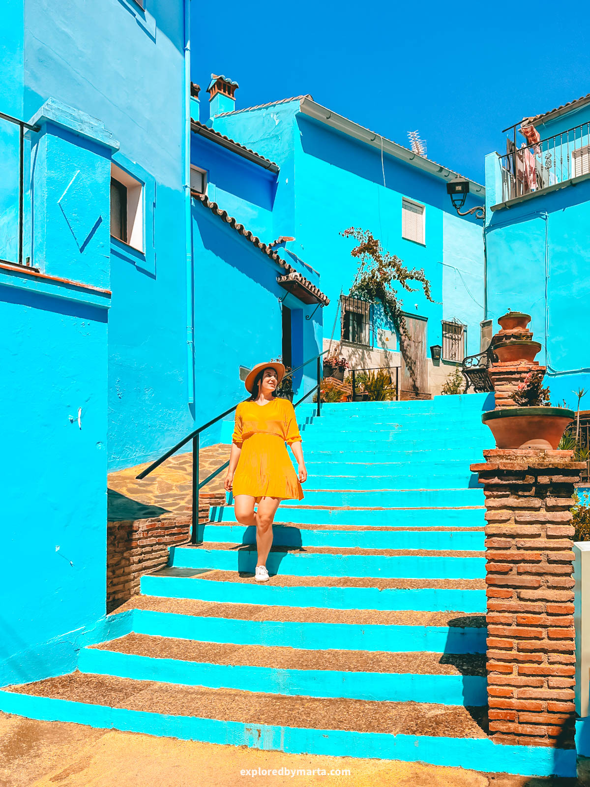 Beautiful blue painted stairs in Juzcar village in Spain